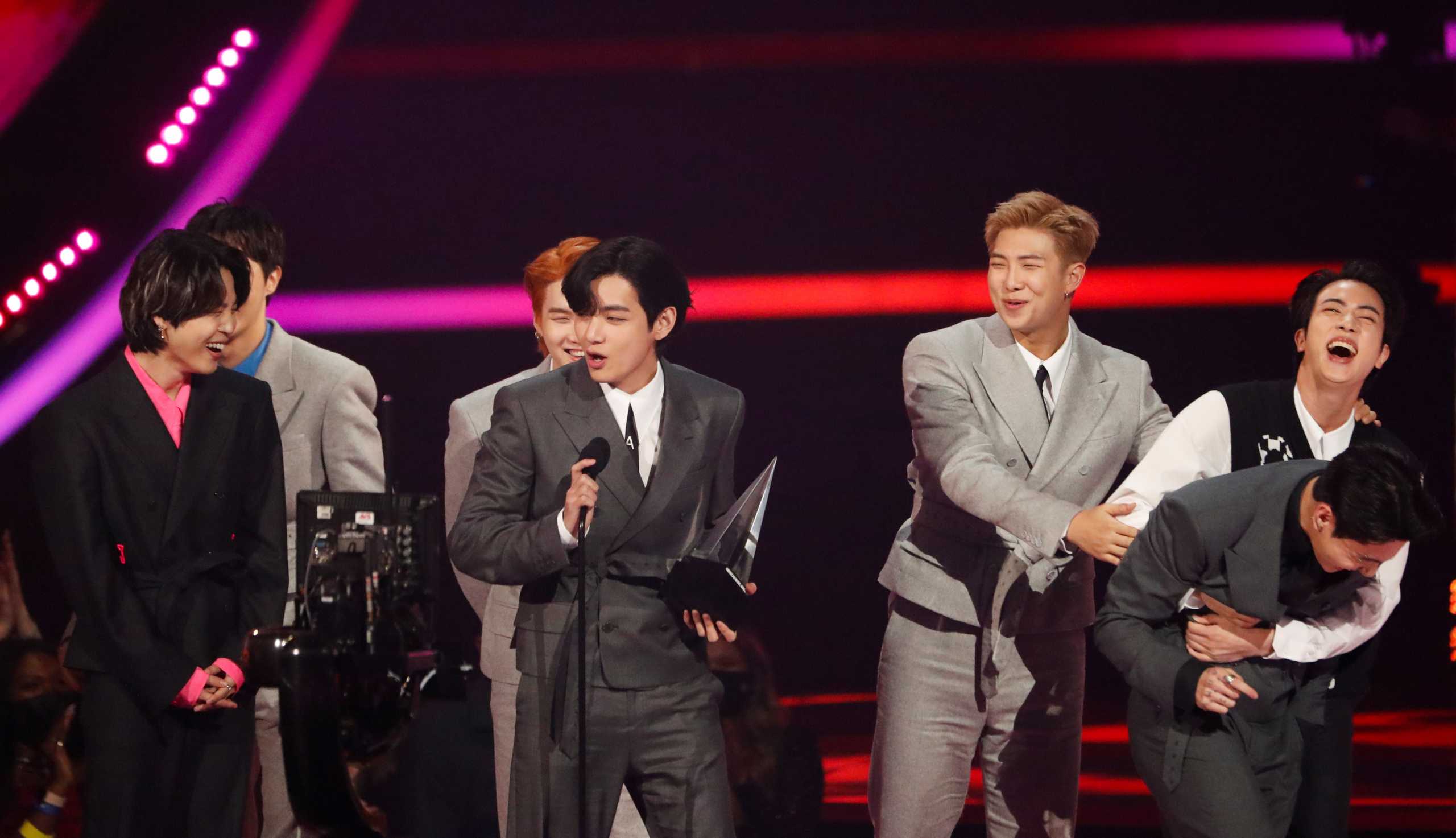 BTS receives an award for Artist of the Year at the 49th Annual American Music Awards at the Microsoft Theatre in Los Angeles, California, U.S., November 21, 2021. REUTERS