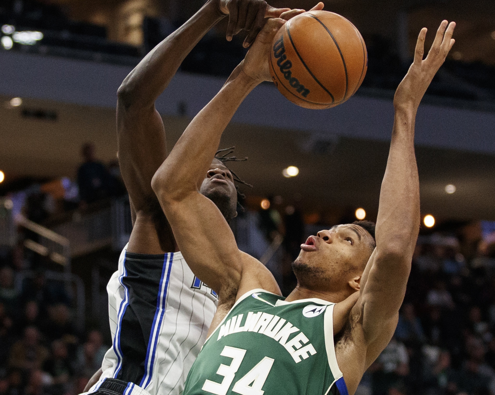 Nov 22, 2021; Milwaukee, Wisconsin, USA;  Milwaukee Bucks forward Giannis Antetokounmpo (34) and Orlando Magic center Mo Bamba (5) battle for a rebound during the third quarter at Fiserv Forum. Mandatory Credit: Jeff Hanisch-USA TODAY Sports