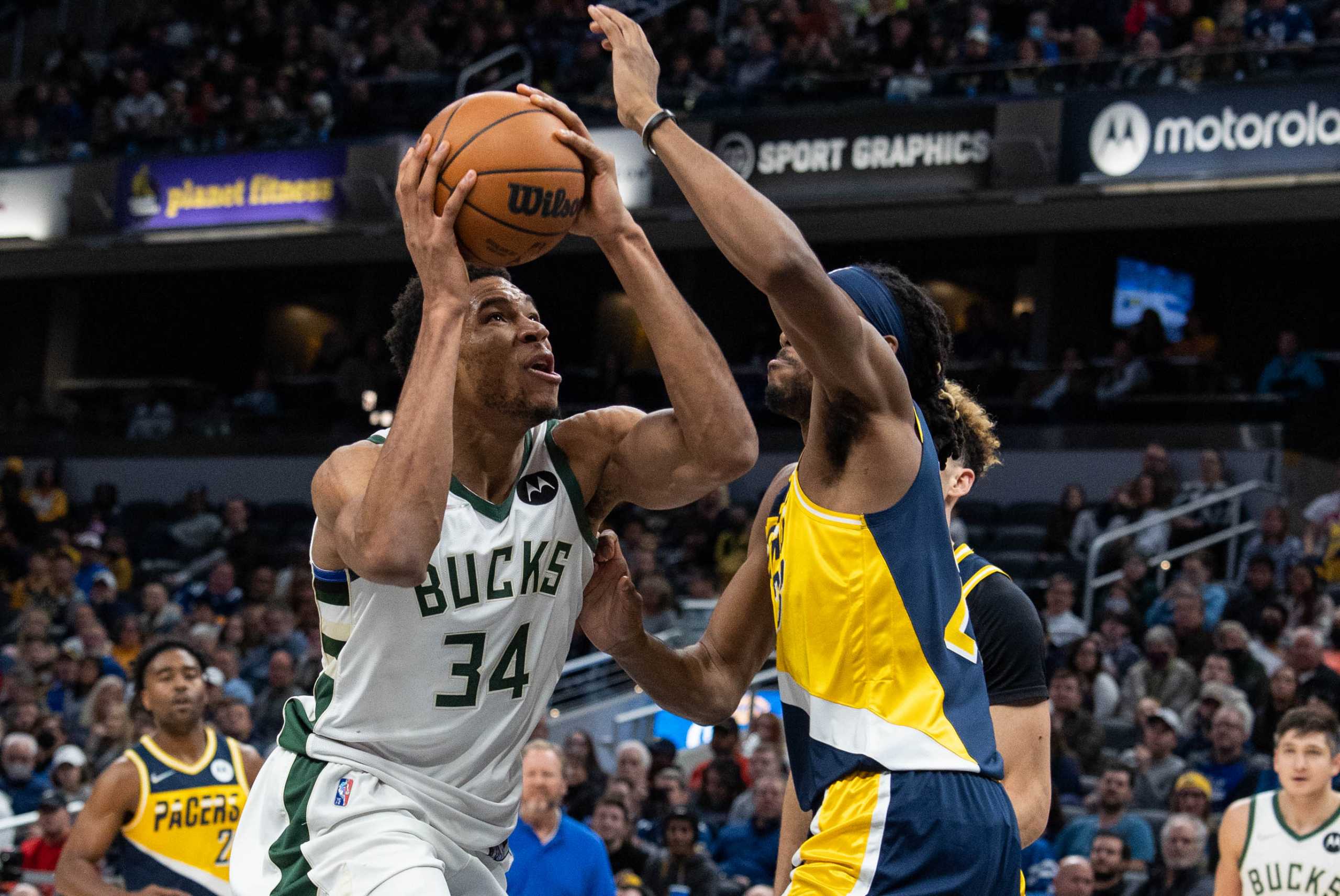 Nov 28, 2021; Indianapolis, Indiana, USA; Milwaukee Bucks forward Giannis Antetokounmpo (34) shoots the ball while Indiana Pacers forward Isaiah Jackson (23) defends  in the second half at Gainbridge Fieldhouse. Mandatory Credit: Trevor Ruszkowski-USA TODAY Sports