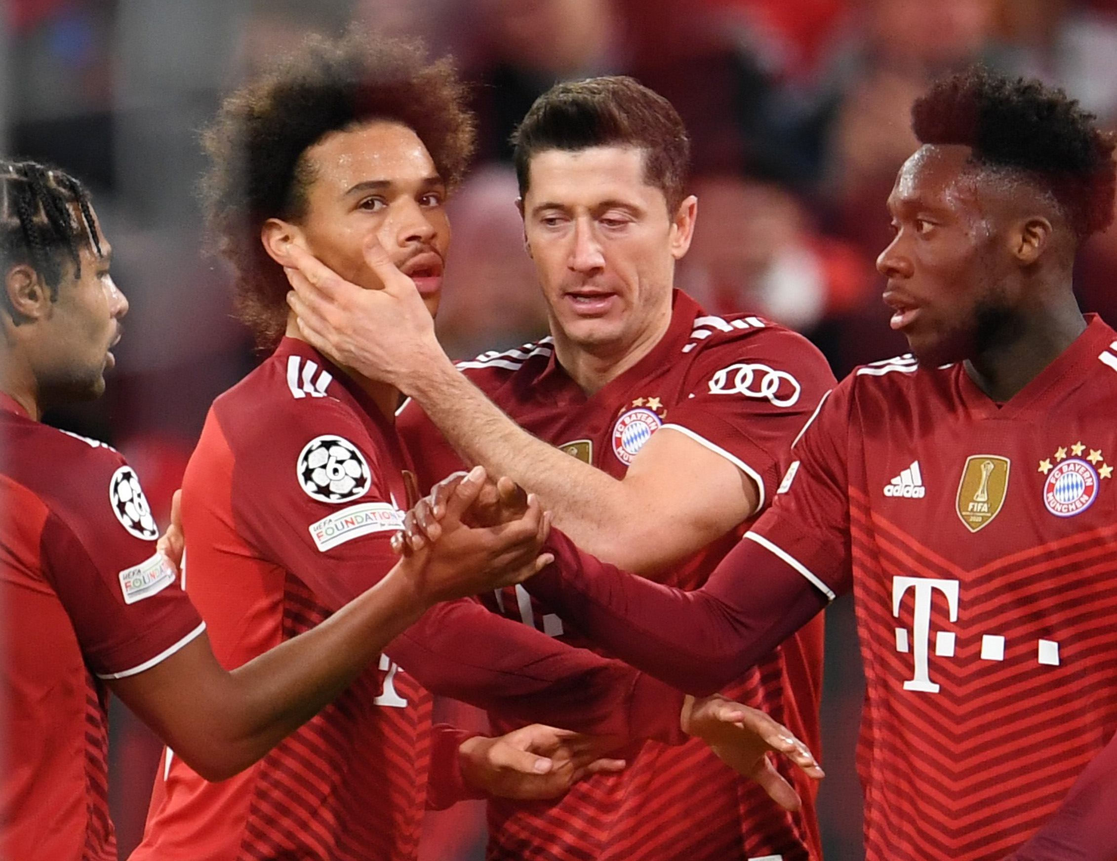 Soccer Football - Champions League - Group E - Bayern Munich v Benfica - Allianz Arena, Munich, Germany - November 2, 2021 Bayern Munich's Robert Lewandowski celebrates scoring their fourth goal with Leroy Sane REUTERS