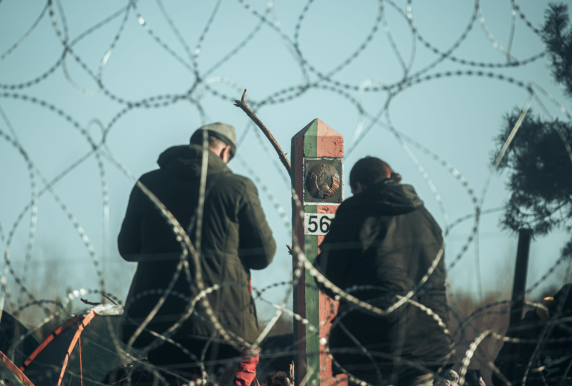 Migrants are seen on the Belarus side of the border with Poland near Kuznica, Poland, in this photograph released by the Polish Defence Ministry, November 9, 2021. Irek Dorozanski