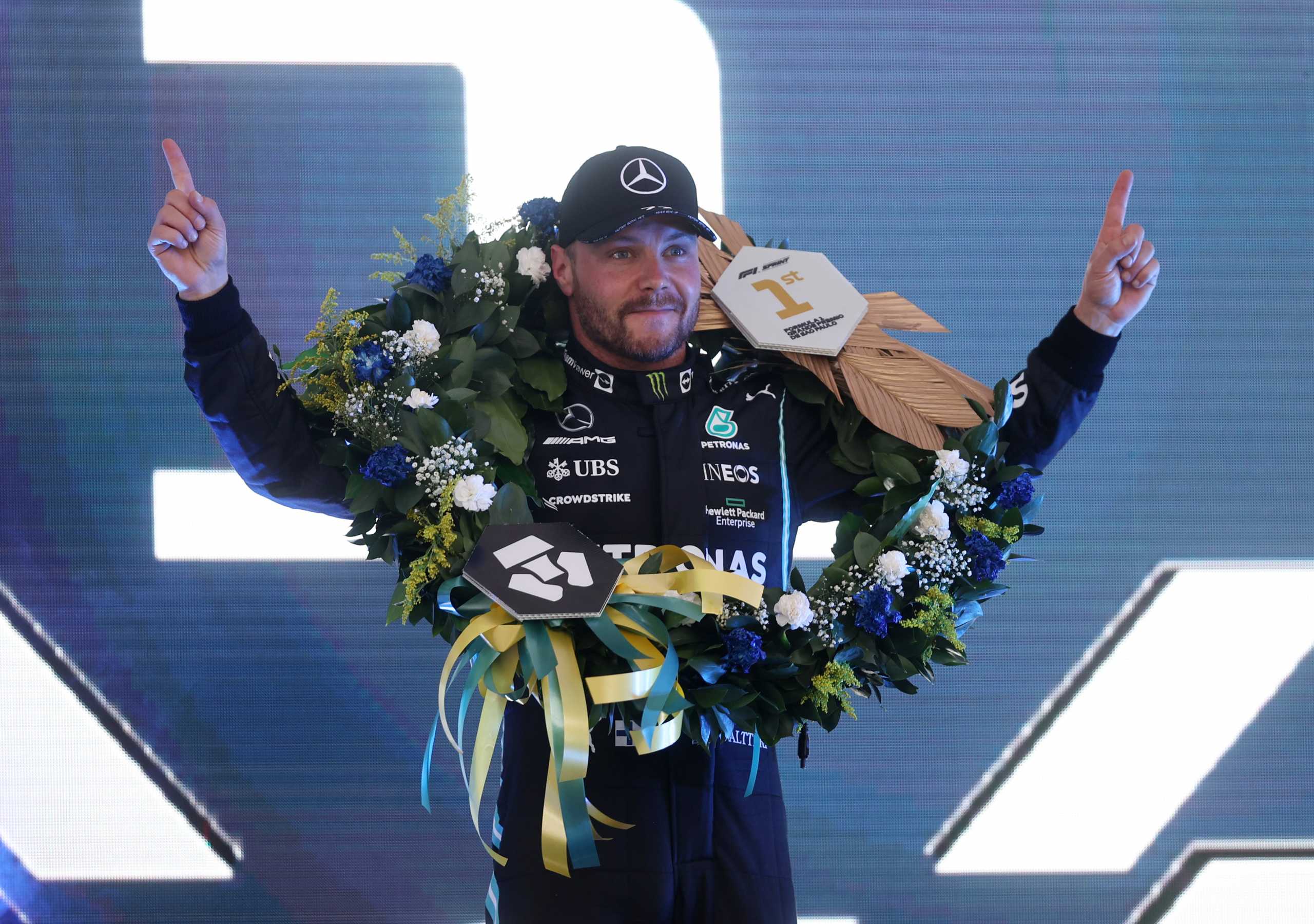 Formula One F1 - Brazilian Grand Prix - Jose Carlos Pace Circuit, Sao Paulo, Brazil - November 13, 2021 Mercedes' Valtteri Bottas celebrates on the podium after finishing in first place during sprint qualifying Pool via REUTERS