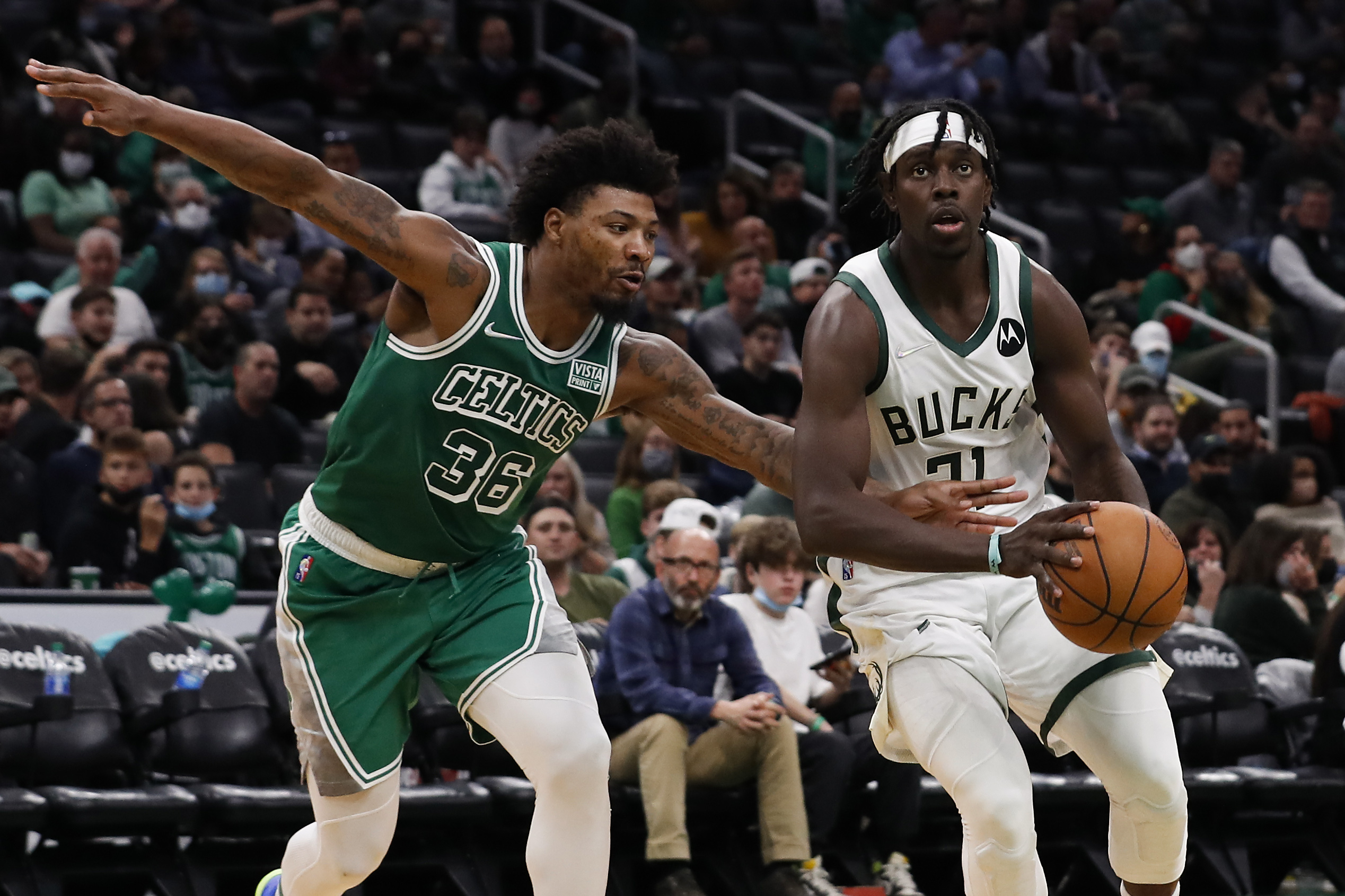 Nov 12, 2021; Boston, Massachusetts, USA; Boston Celtics guard Marcus Smart (36) tries to steal the ball from Milwaukee Bucks guard Jrue Holiday (21) during the third quarter at TD Garden. Mandatory Credit: Winslow Townson-USA TODAY Sports