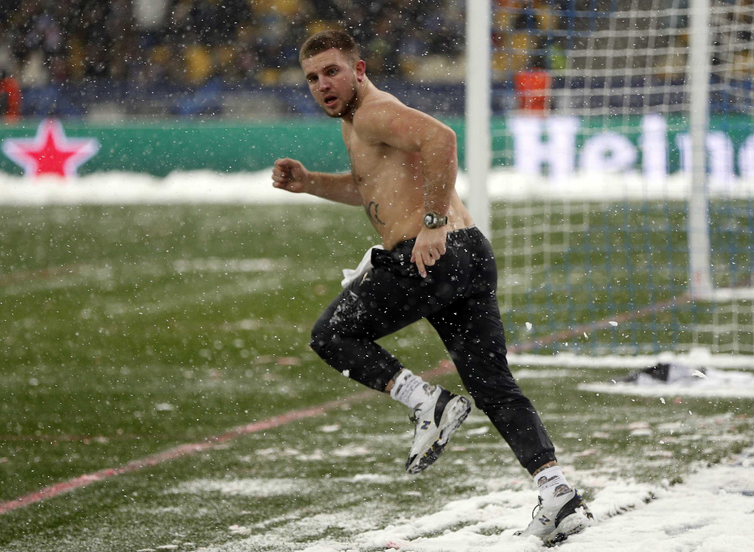 Soccer Football - Champions League - Group E - Dynamo Kyiv v Bayern Munich - NSC Olympiyskiy, Kyiv, Ukraine - November 23, 2021 A fan invades the pitch during the match REUTERS
