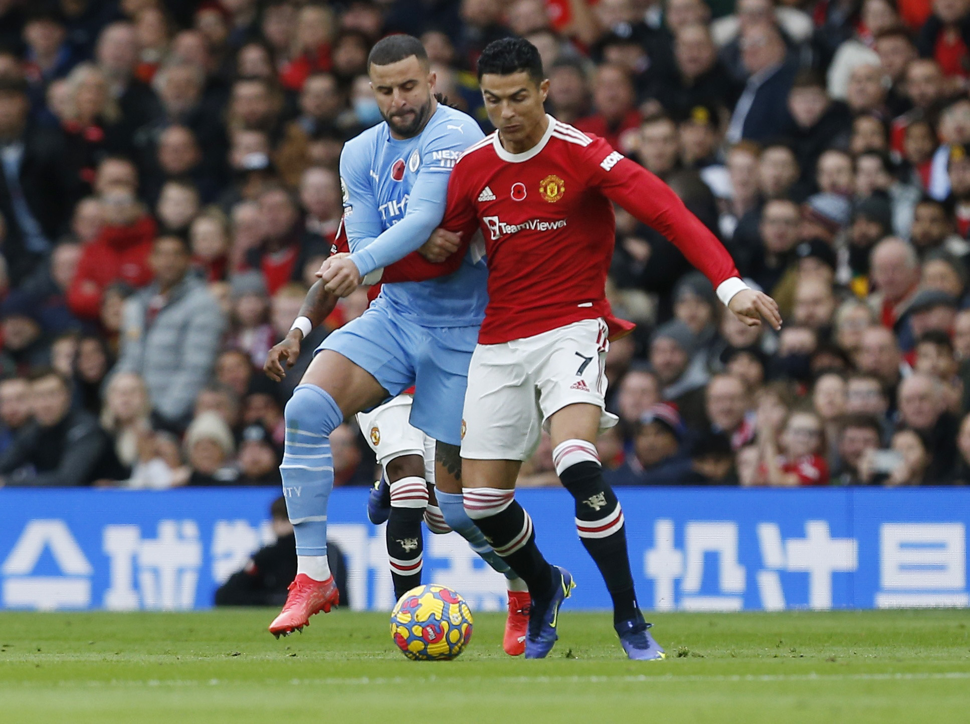 Soccer Football - Premier League - Manchester United v Manchester City - Old Trafford, Manchester, Britain - November 6, 2021 Manchester City's Kyle Walker in action with Manchester United's Cristiano Ronaldo REUTERS