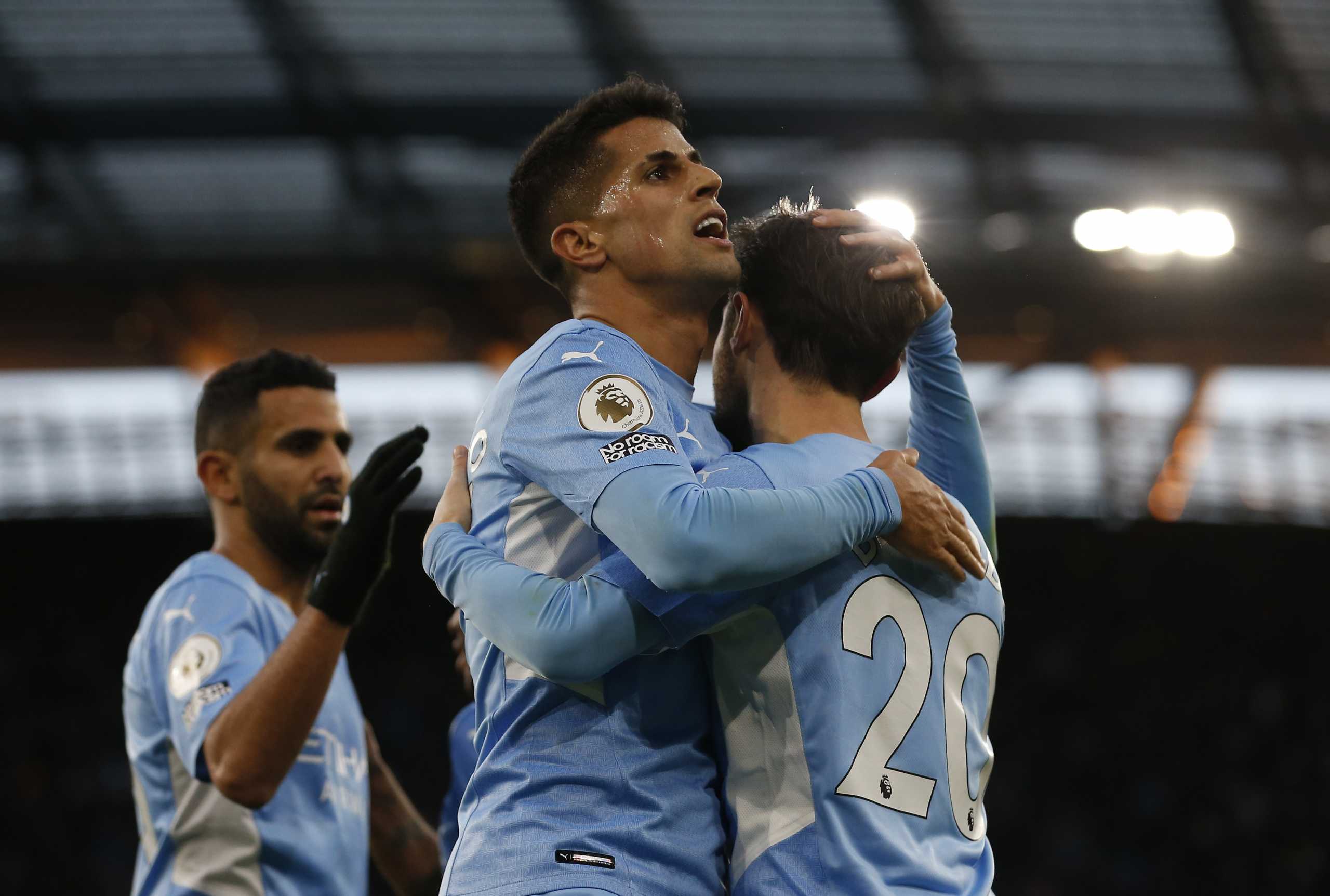 Soccer Football - Premier League - Manchester City v Everton - Etihad Stadium, Manchester, Britain - November 21, 2021 Manchester City's Bernardo Silva celebrates scoring their third goal with Joao Cancelo REUTERS