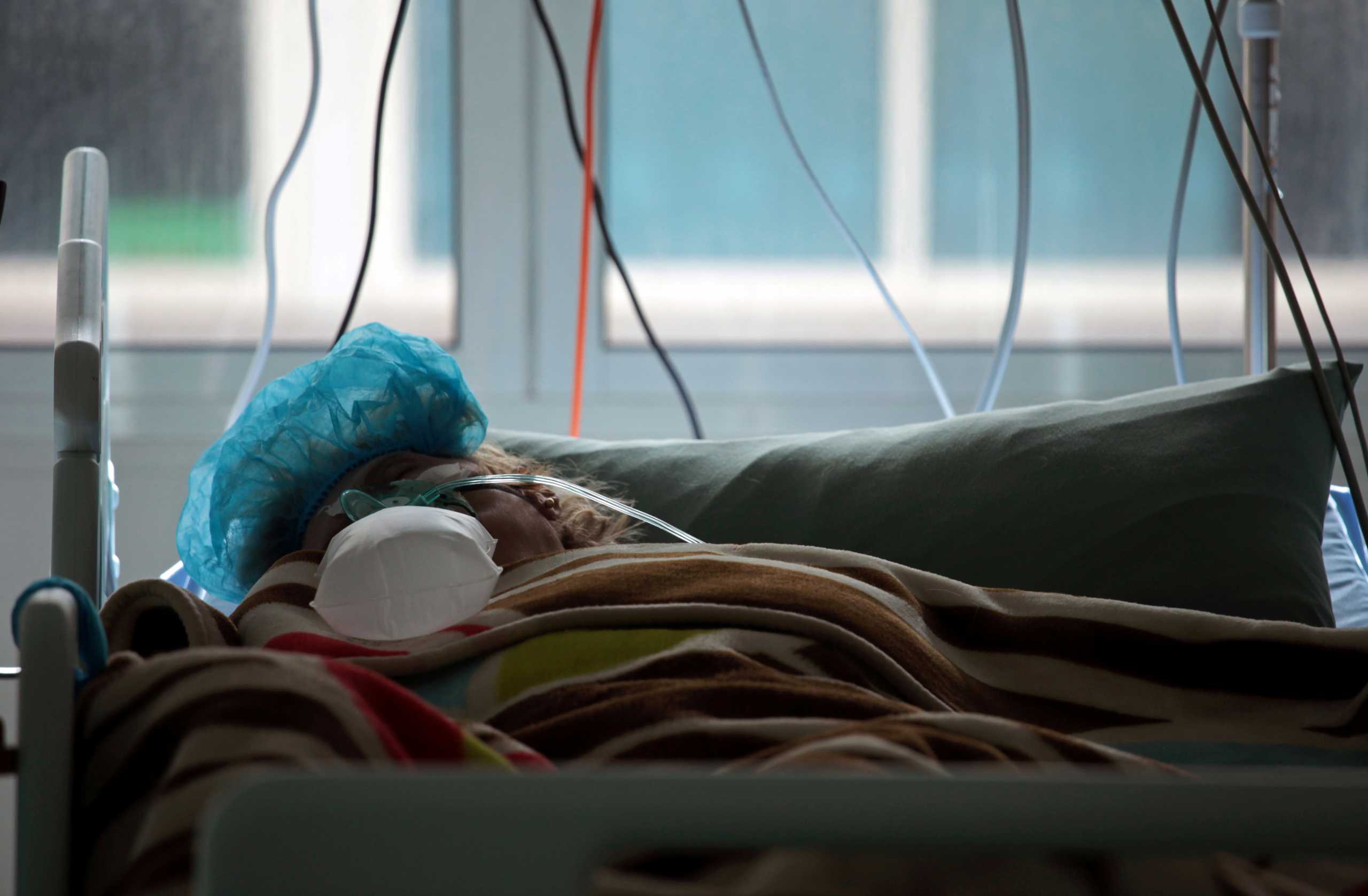 FILE PHOTO: A patient suffering from the coronavirus disease (COVID-19), lies in bed at an intensive care unit at Rafik Hariri University Hospital, in Beirut, Lebanon January 21, 2021. Picture taken January 21, 2021. REUTERS