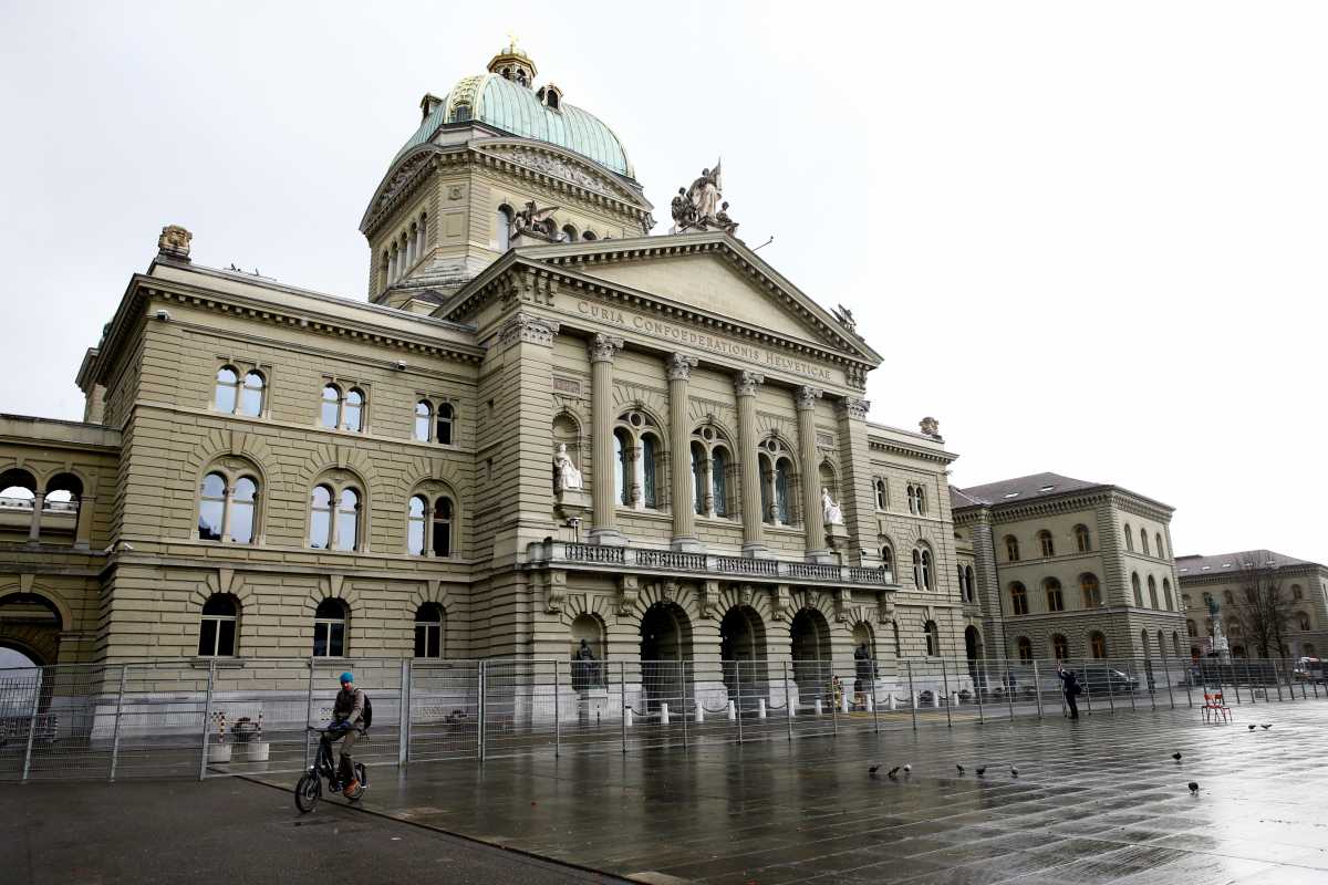 A fence is seen in front of the Swiss Federal Palace, Bundeshaus, in Bern, Switzerland, November 28, 2021. REUTERS