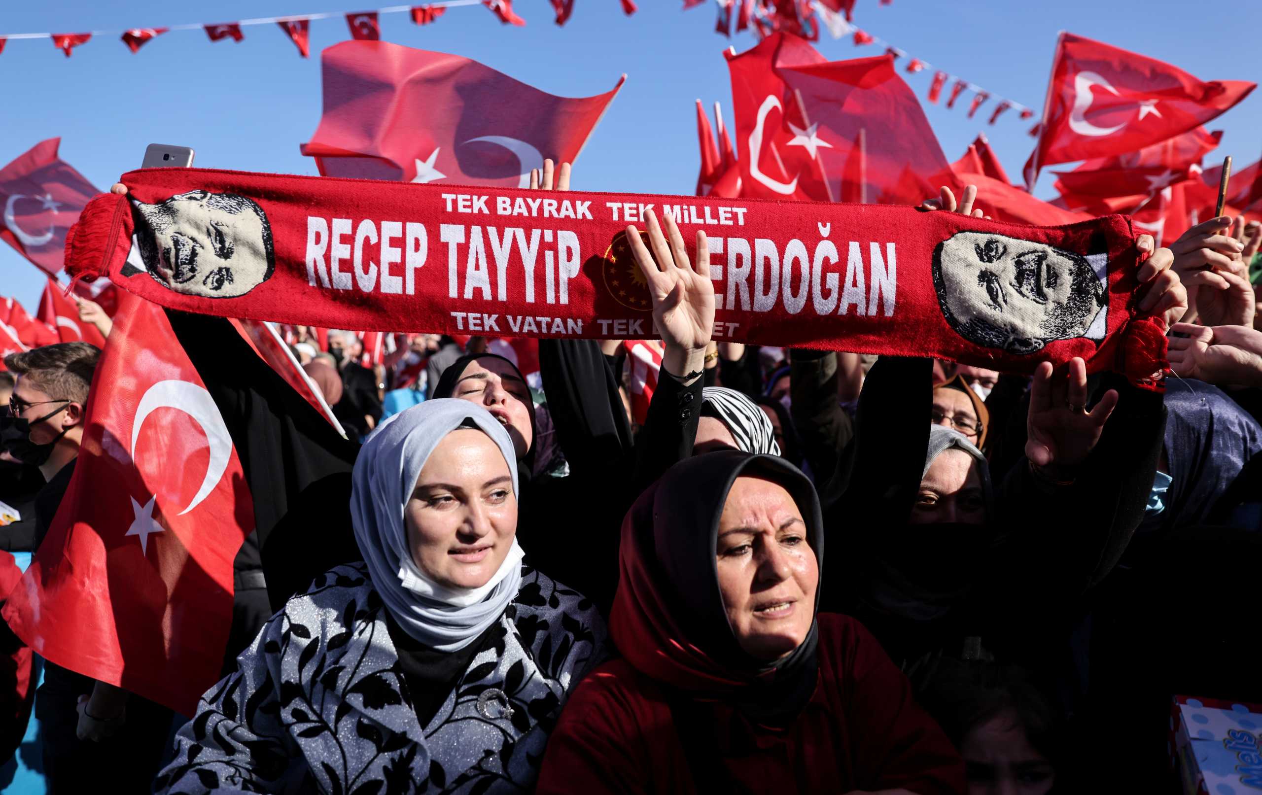 Supporters of Turkish President Tayyip Erdogan wave national flags during a ceremony in Istanbul, Turkey, November 5, 2021. REUTERS