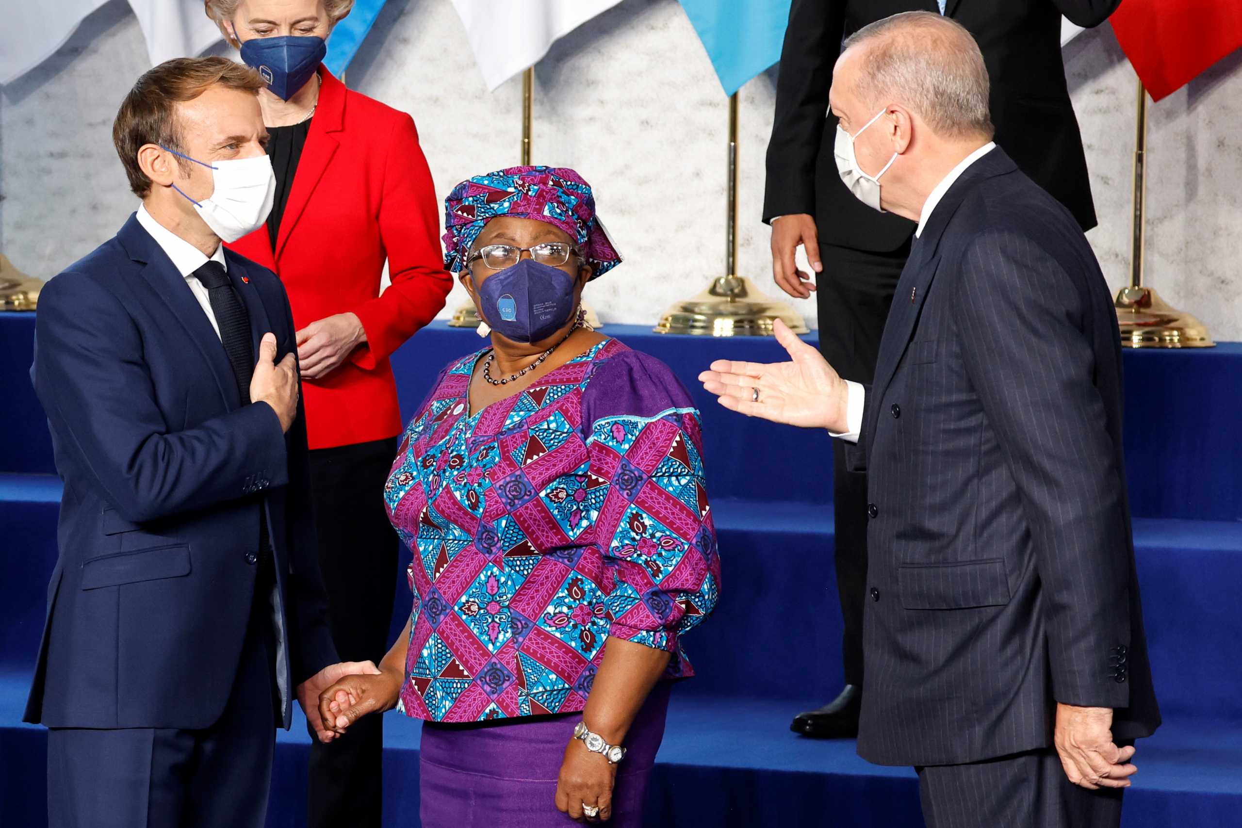 French President Emmanuel Macron, World Trade Organization Director-General Ngozi Okonjo-Iweala and Turkish President Recep Tayyip Erdogan speak together before a family picture during the G20 leaders summit at the convention center "La Nuvola" in Rome, October 30, 2021. Ludovic Marin