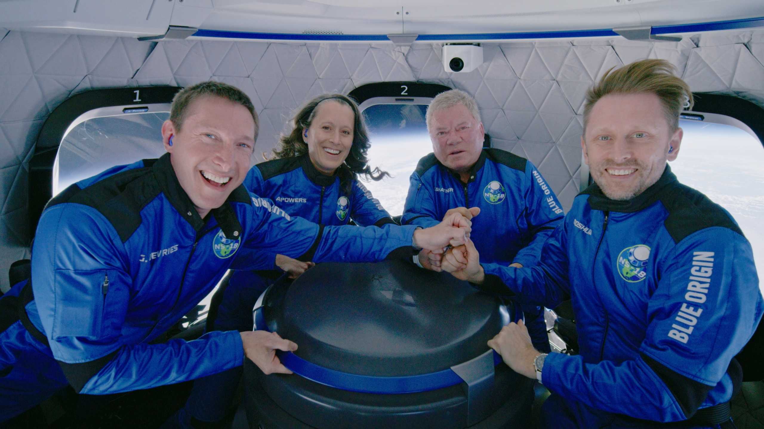 FILE PHOTO: Star Trek actor William Shatner poses with Audrey Powers, Blue Origin's vice president of mission and flight operations and a former NASA flight controller and engineer; Chris Boshuizen, the co-founder of satellite company Planet Labs and a former space mission architect for NASA; and Glen de Vries, the co-founder of Medidata Solutions, a life science company during the Blue Origin New Shepard mission NS-18 suborbital flight near Van Horn, Texas, U.S. October 13, 2021. Blue Origin