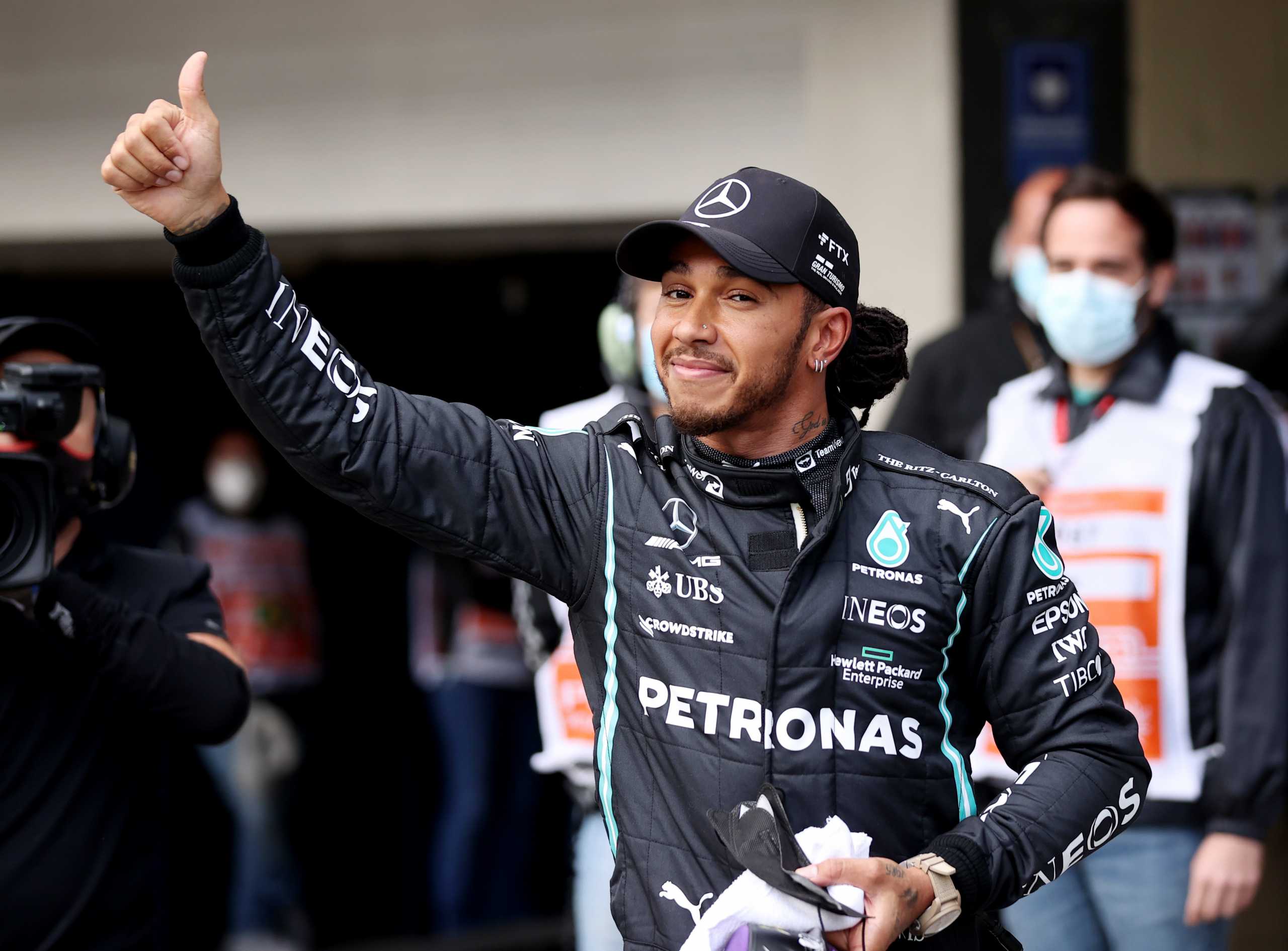 Formula One F1 - Brazilian Grand Prix - Jose Carlos Pace Circuit, Sao Paulo, Brazil - November 12, 2021 Mercedes' Lewis Hamilton celebrates after finishing first in qualifying Pool via REUTERS
