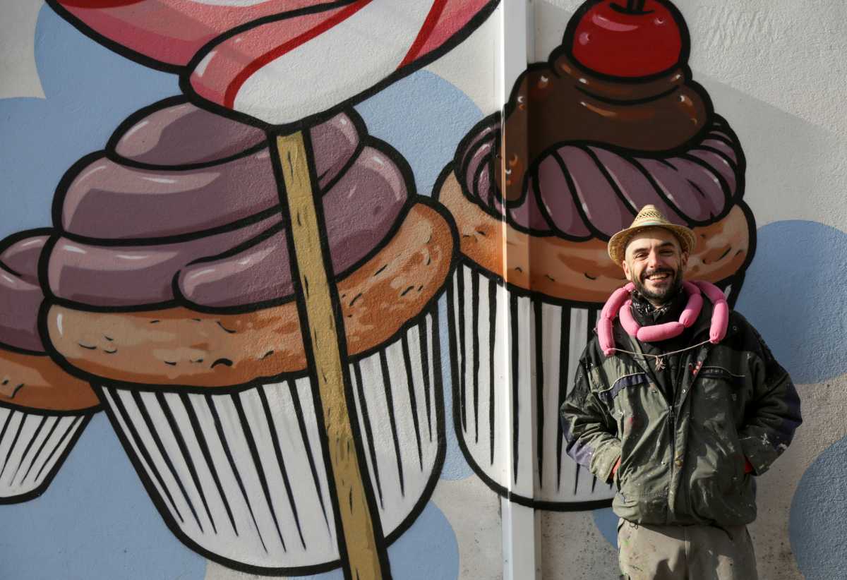 Italian street artist Pier Paolo Spinazze, 39, known as 'Cibo' (Italian for food), who covers racist graffiti with murals of food, poses for a portrait near Verona, Italy, November 18, 2021. Picture taken November 18, 2021. REUTERS