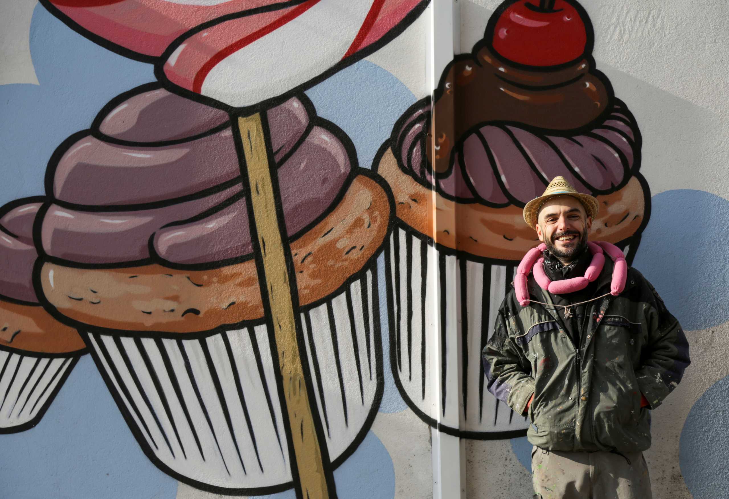 Italian street artist Pier Paolo Spinazze, 39, known as 'Cibo' (Italian for food), who covers racist graffiti with murals of food, poses for a portrait near Verona, Italy, November 18, 2021. Picture taken November 18, 2021. REUTERS