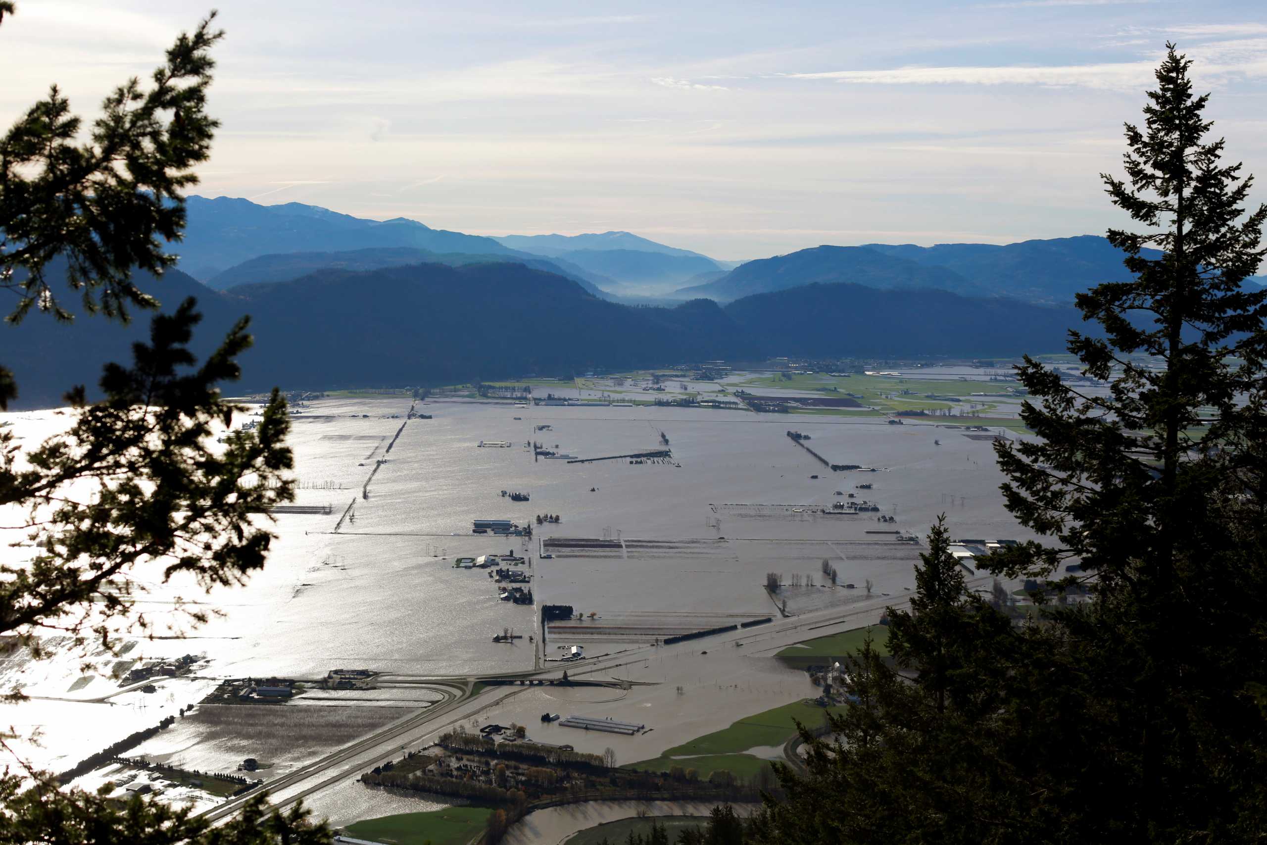 Flooded houses and farms are seen from the top of Sumas Mountain after rainstorms caused flooding and landslides in Abbotsford, British Columbia, Canada November 17, 2021.  REUTERS
