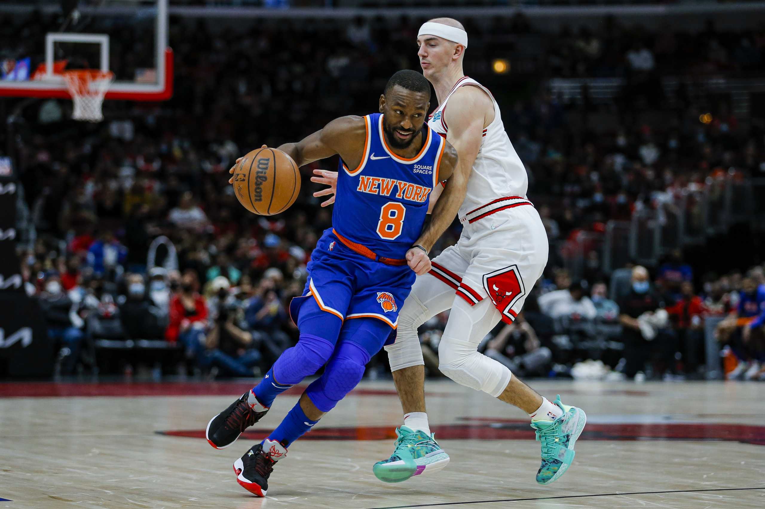 Nov 21, 2021; Chicago, Illinois, USA; New York Knicks guard Kemba Walker (8) dribbles the ball past Chicago Bulls guard Alex Caruso (6) during the second half at United Center. The Chicago Bulls won 109-103. Mandatory Credit: Jon Durr-USA TODAY Sports