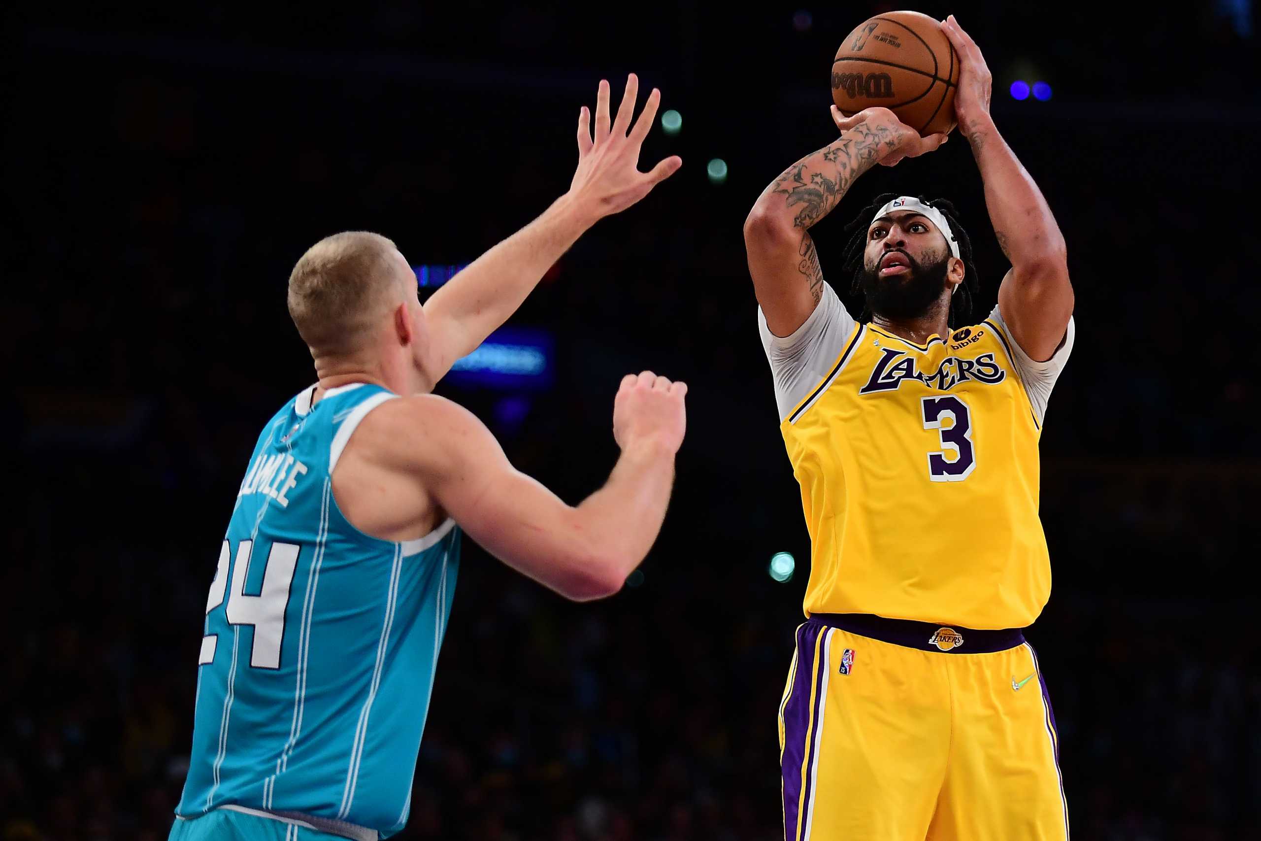 Nov 8, 2021; Los Angeles, California, USA; Los Angeles Lakers forward Anthony Davis (3) shoots against Charlotte Hornets center Mason Plumlee (24) during the second half at Staples Center. Mandatory Credit: Gary A. Vasquez-USA TODAY Sports