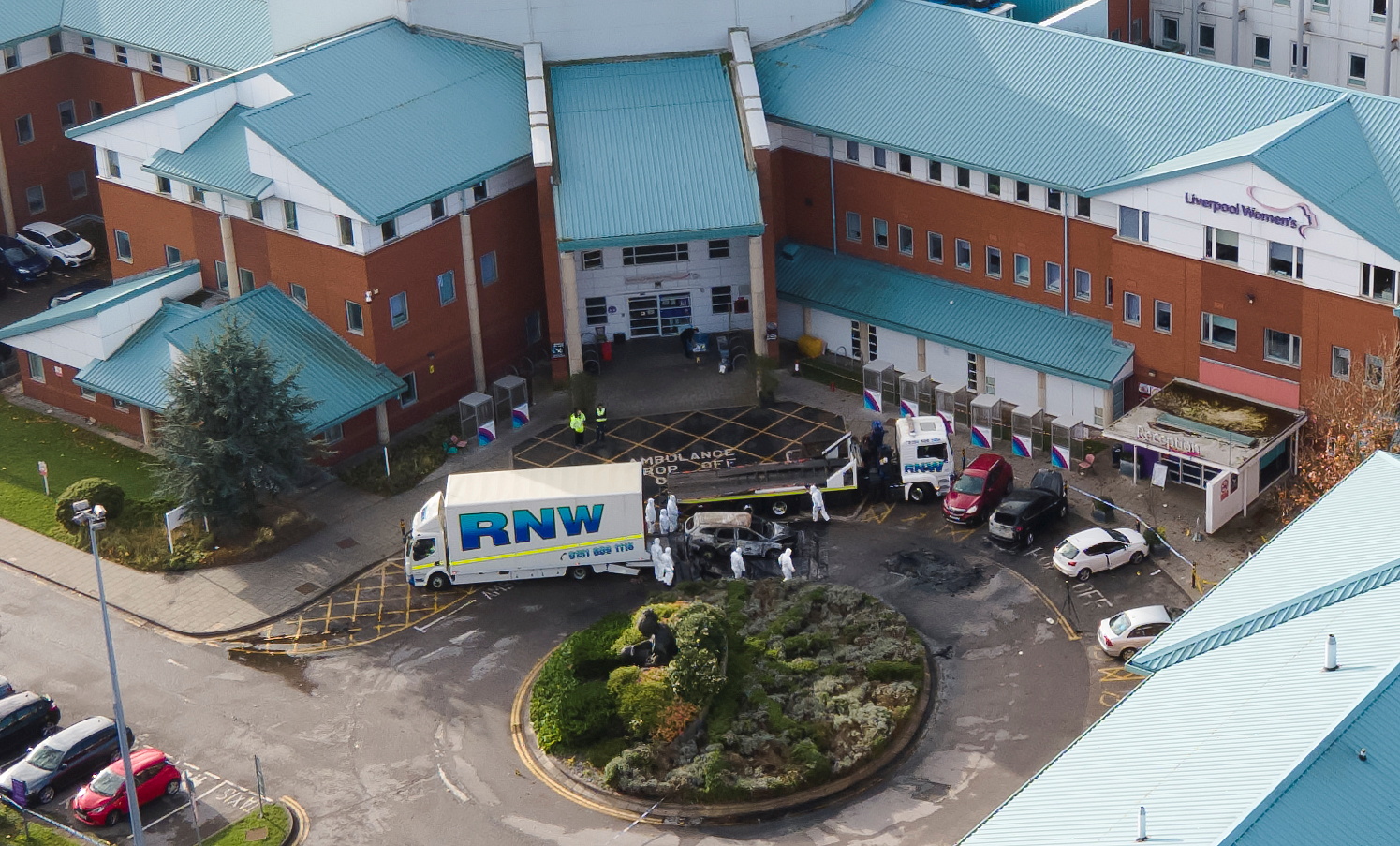 Police forensic officers stand near the remains of a taxi that exploded outside Liverpool Women's Hospital in Liverpool, Britain, November 17, 2021. Picture taken with a drone. REUTERS