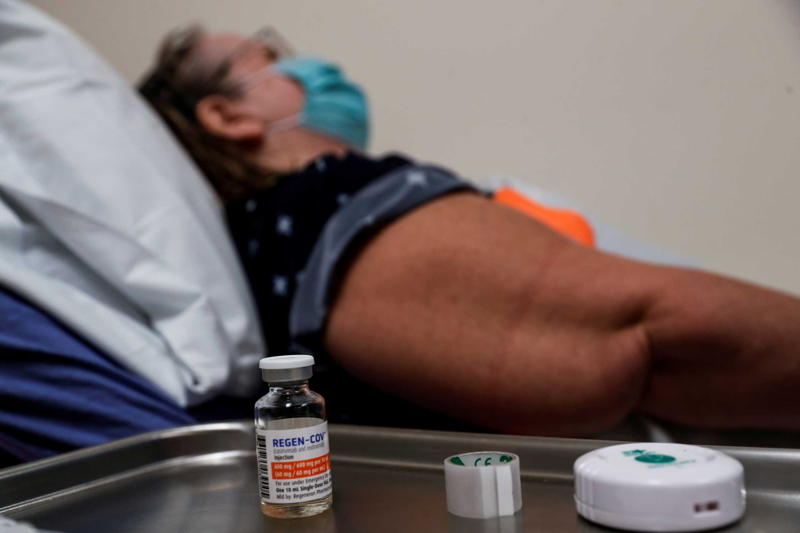 FILE PHOTO: The Regeneron monoclonal antibody sits on a medical table as registered nurse Jessica Krumwiede attempts to find a vein to administer it to Cathy Hardin, who was vaccinated prior to testing positive for the coronavirus disease (COVID-19), at the Sarasota Memorial Urgent Care Center in Sarasota, Florida, U.S., September 23, 2021. REUTERS