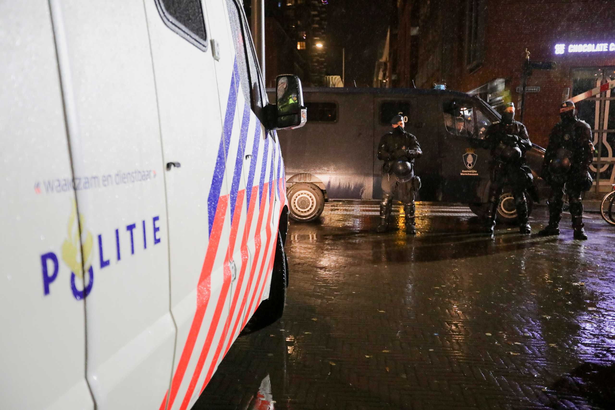 Police officers stand guard following Dutch Prime Minister Mark Rutte's announcement of new measures to fight a record surge in coronavirus disease (COVID-19) infections, in The Hague, Netherlands, November 26, 2021. REUTERS