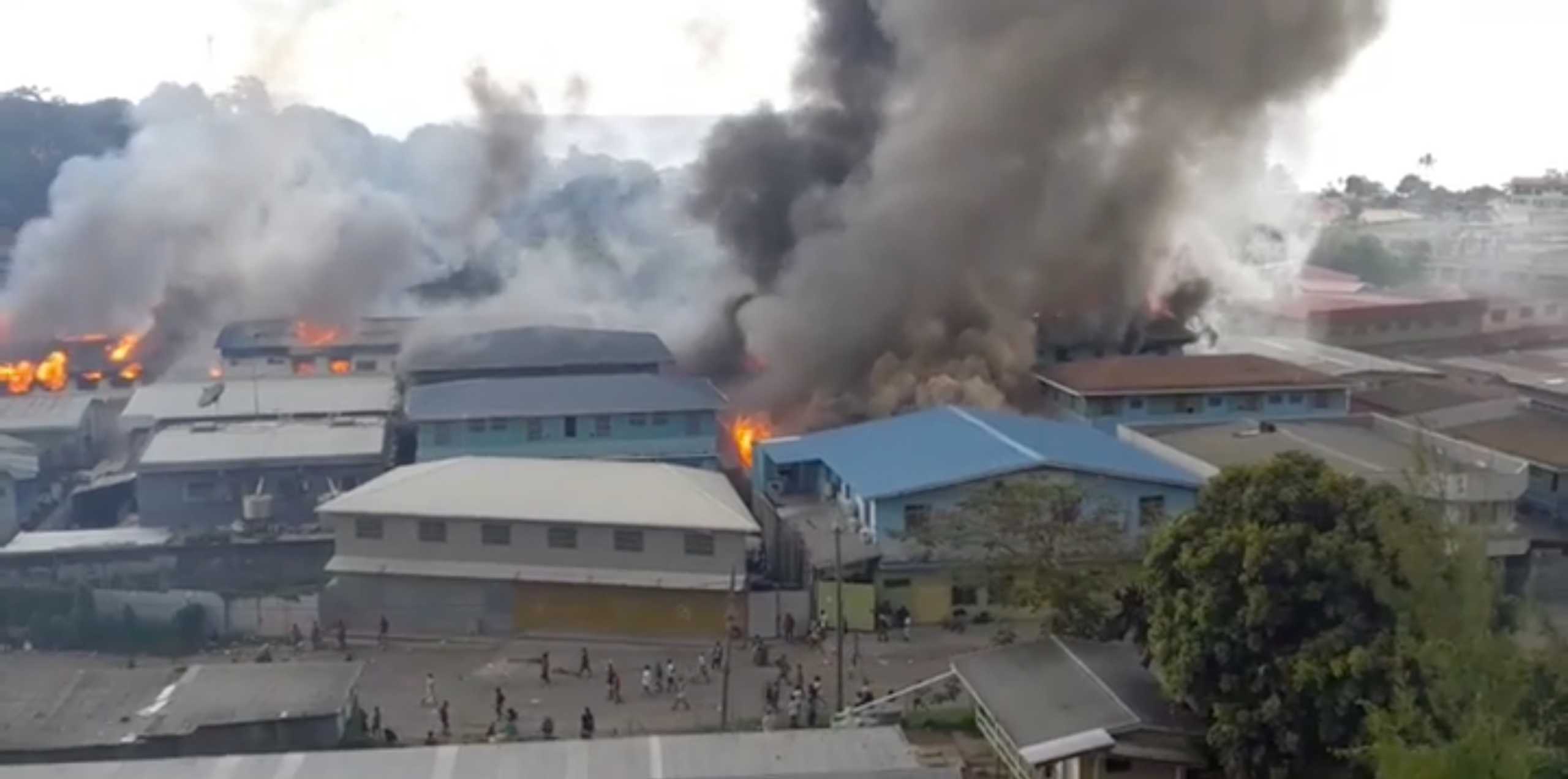 Smoke rises from burning buildings in Chinatown of Solomon Islands' capital Honiara, Solomon Islands, November 25, 2021 in this picture obtained from a social media video. @Zfm Radio My Favourite Music Station via REUTERS   THIS IMAGE HAS BEEN SUPPLIED BY A THIRD PARTY. MANDATORY CREDIT. NO RESALES. NO ARCHIVES.