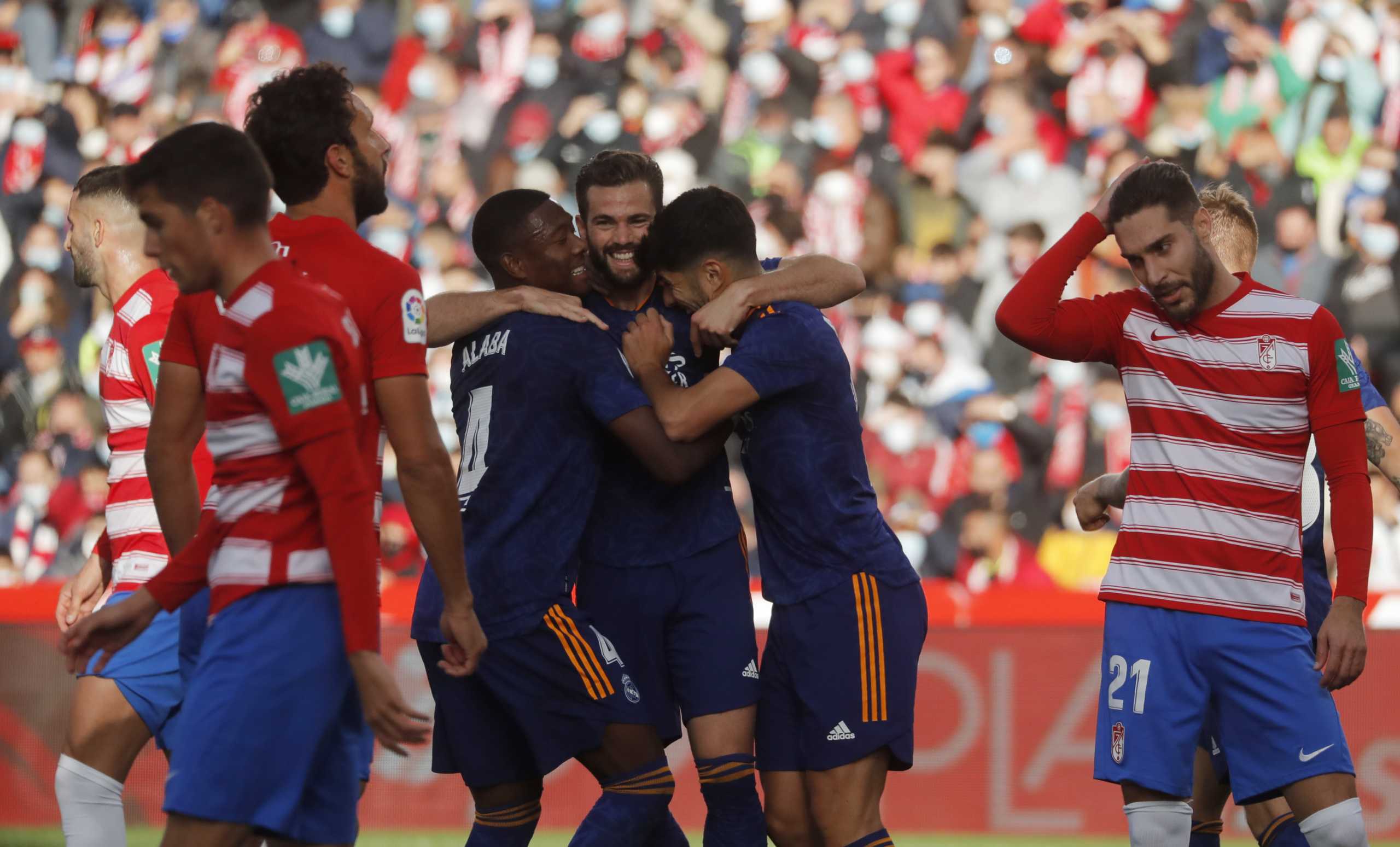 Soccer Football - LaLiga - Granada v Real Madrid - Nuevo Estadio de Los Carmenes, Granada, Spain - November 21, 2021 Real Madrid's Nacho celebrates scoring their second goal with teammates REUTERS