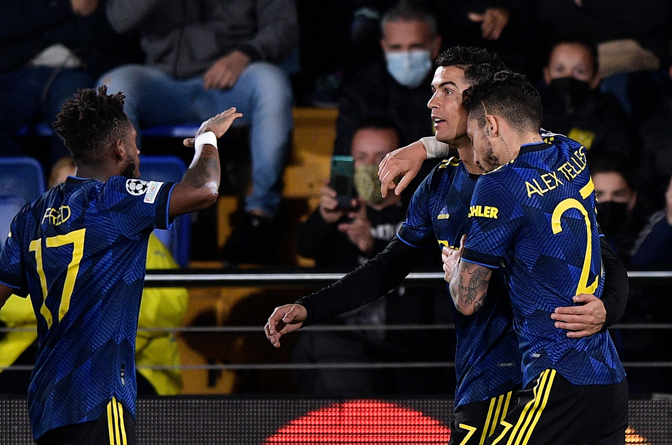 Soccer Football - Champions League - Group F - Villarreal v Manchester United - Estadio de la Ceramica, Villarreal, Spain - November 23, 2021 Manchester United's Cristiano Ronaldo celebrates scoring their first goal with Alex Telles REUTERS