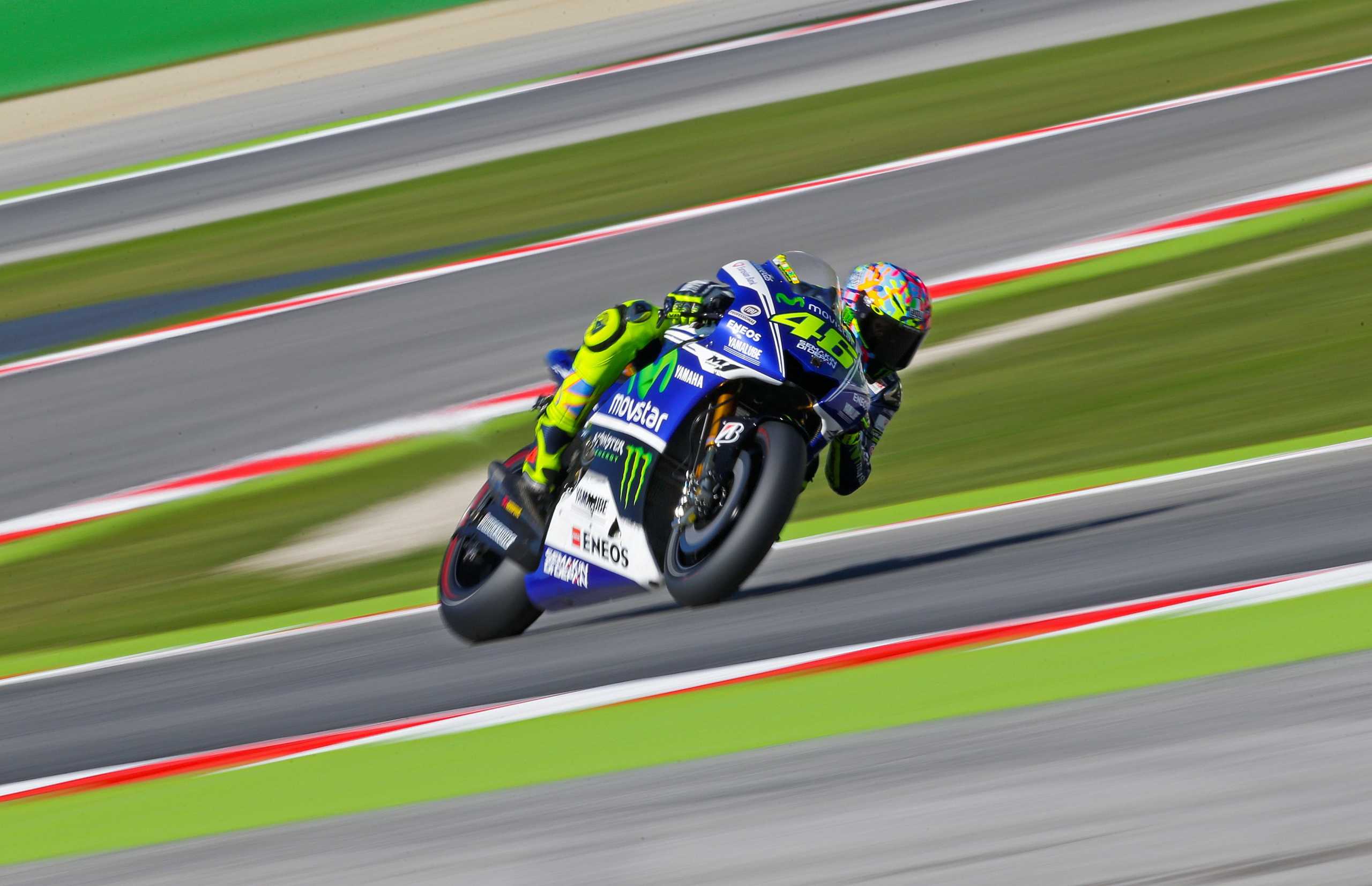FILE PHOTO: Yamaha MotoGP rider Valentino Rossi of Italy takes a curve during the third practice session of the San Marino Grand Prix in Misano Adriatico circuit in central Italy September 13, 2014. REUTERS