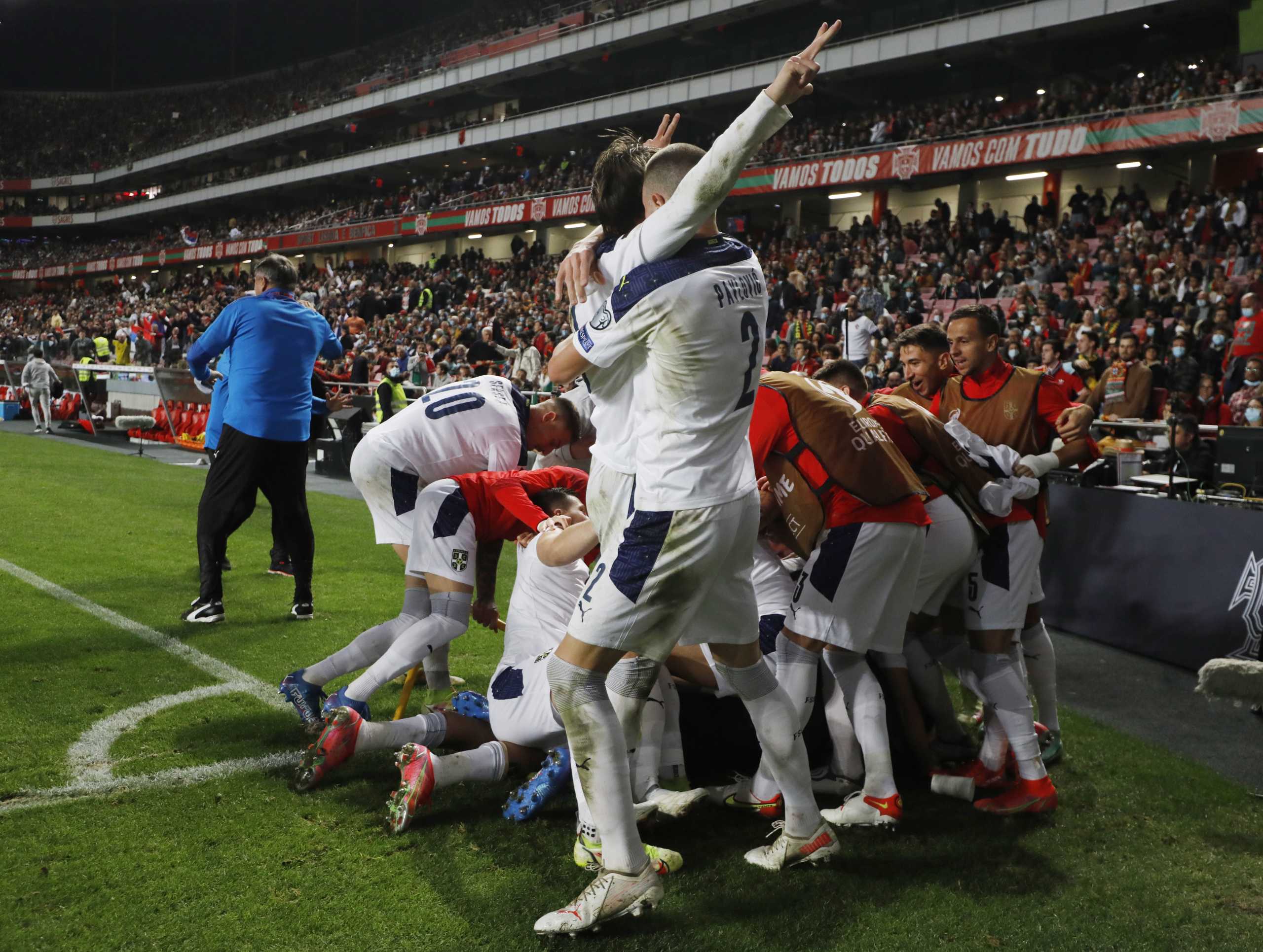 Soccer Football - World Cup - UEFA Qualifiers - Group A - Portugal v Serbia - Estadio da Luz, Lisbon, Portugal - November 14, 2021 Serbia's Aleksandar Mitrovic celebrates scoring their second goal with teammates REUTERS