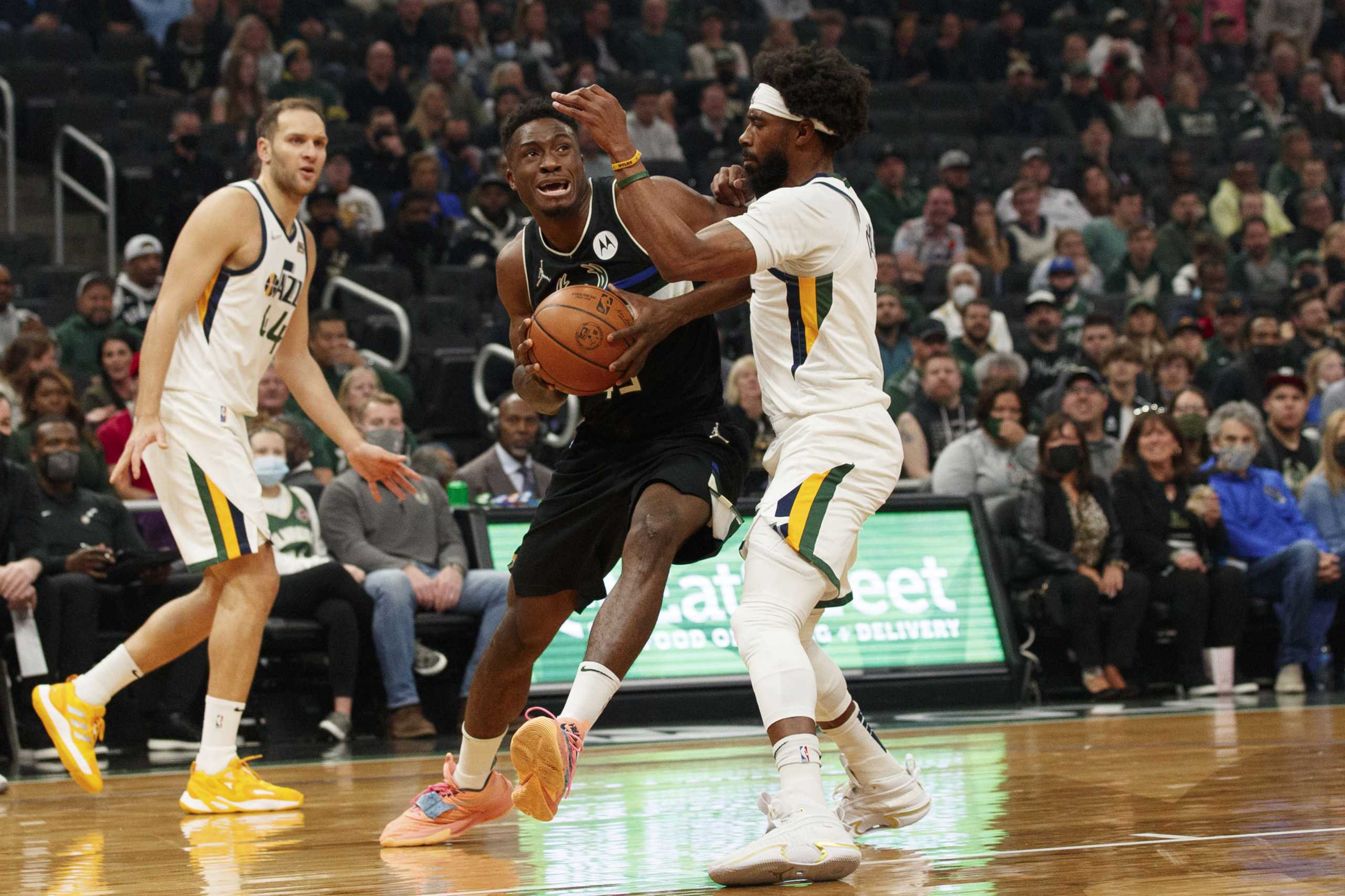 Oct 31, 2021; Milwaukee, Wisconsin, USA;  Milwaukee Bucks forward Thanasis Antetokounmpo (43) drives for the basket against Utah Jazz guard Mike Conley (11) during the first quarter at Fiserv Forum. Mandatory Credit: Jeff Hanisch-USA TODAY Sports