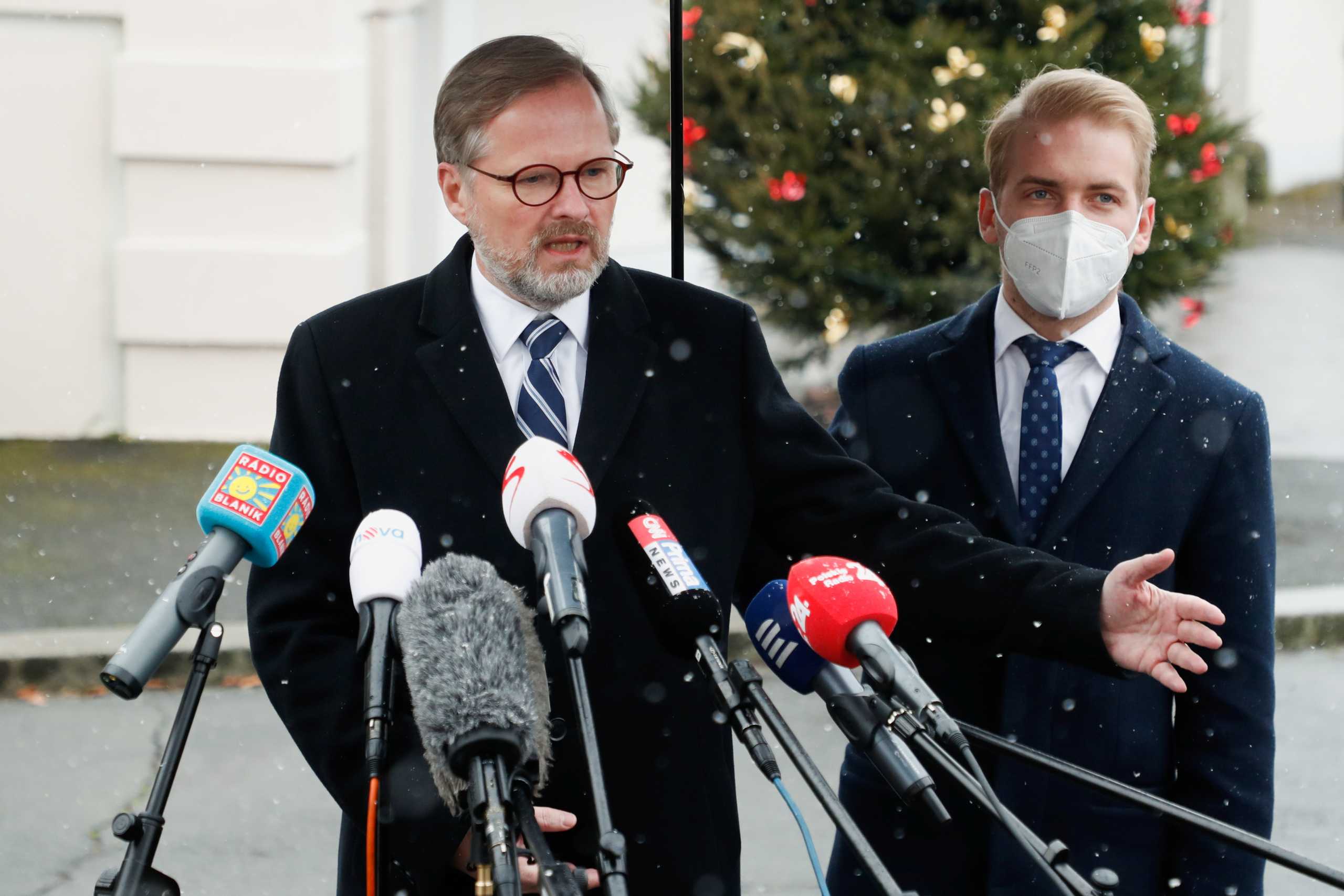 Newly appointed Czech Prime Minister Petr Fiala speaks to members of the media in front of the Lany Chateau in the village of Lany near Prague, Czech Republic, November 28, 2021. REUTERS