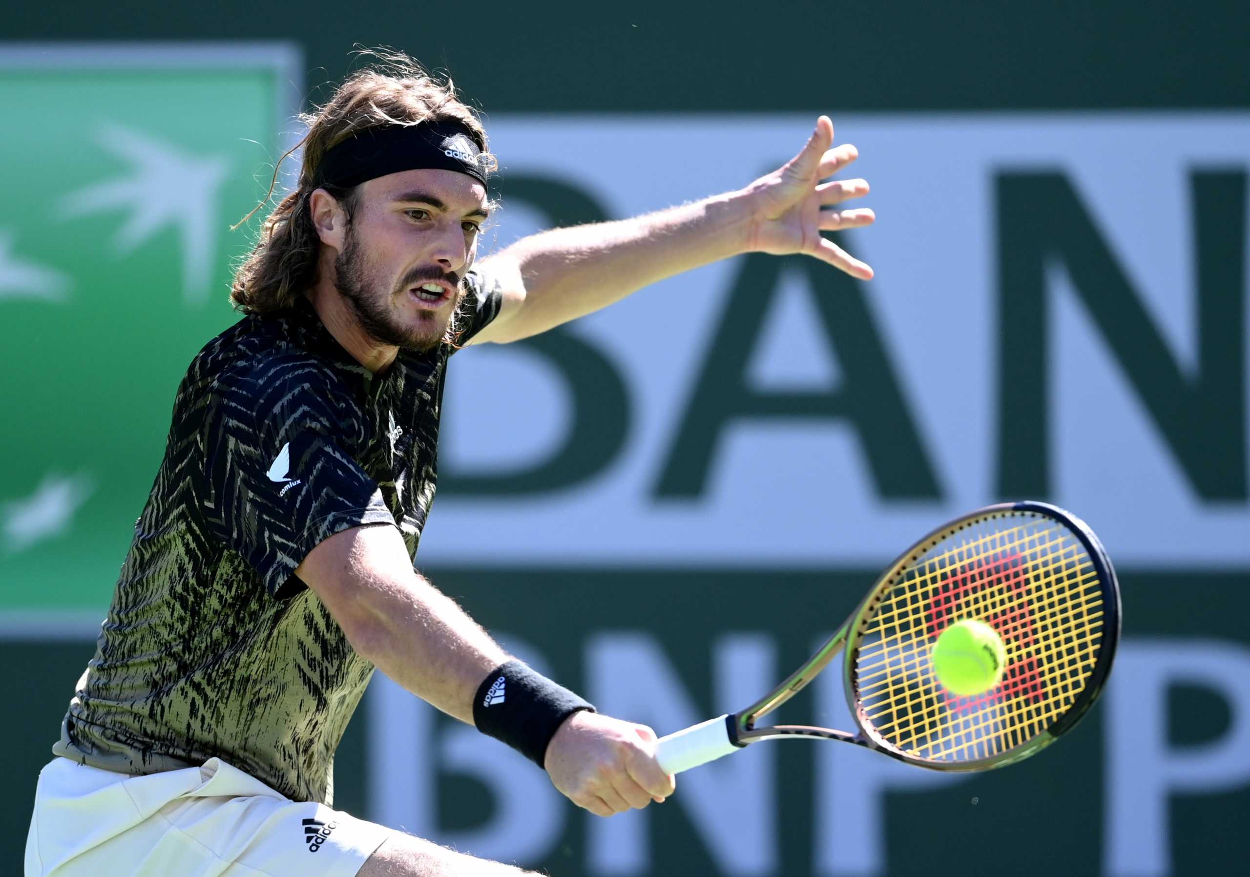 FILE PHOTO: Oct 15, 2021; Indian Wells, CA, USA;   Stefanos Tsitsipas (GRE)hits a shot during his quarter final match against Nikoloz Basilashvili (GEO) during the BNP Paribas Open at the Indian Wells Tennis Garden. Mandatory Credit: Jayne Kamin-Oncea-USA TODAY Sports