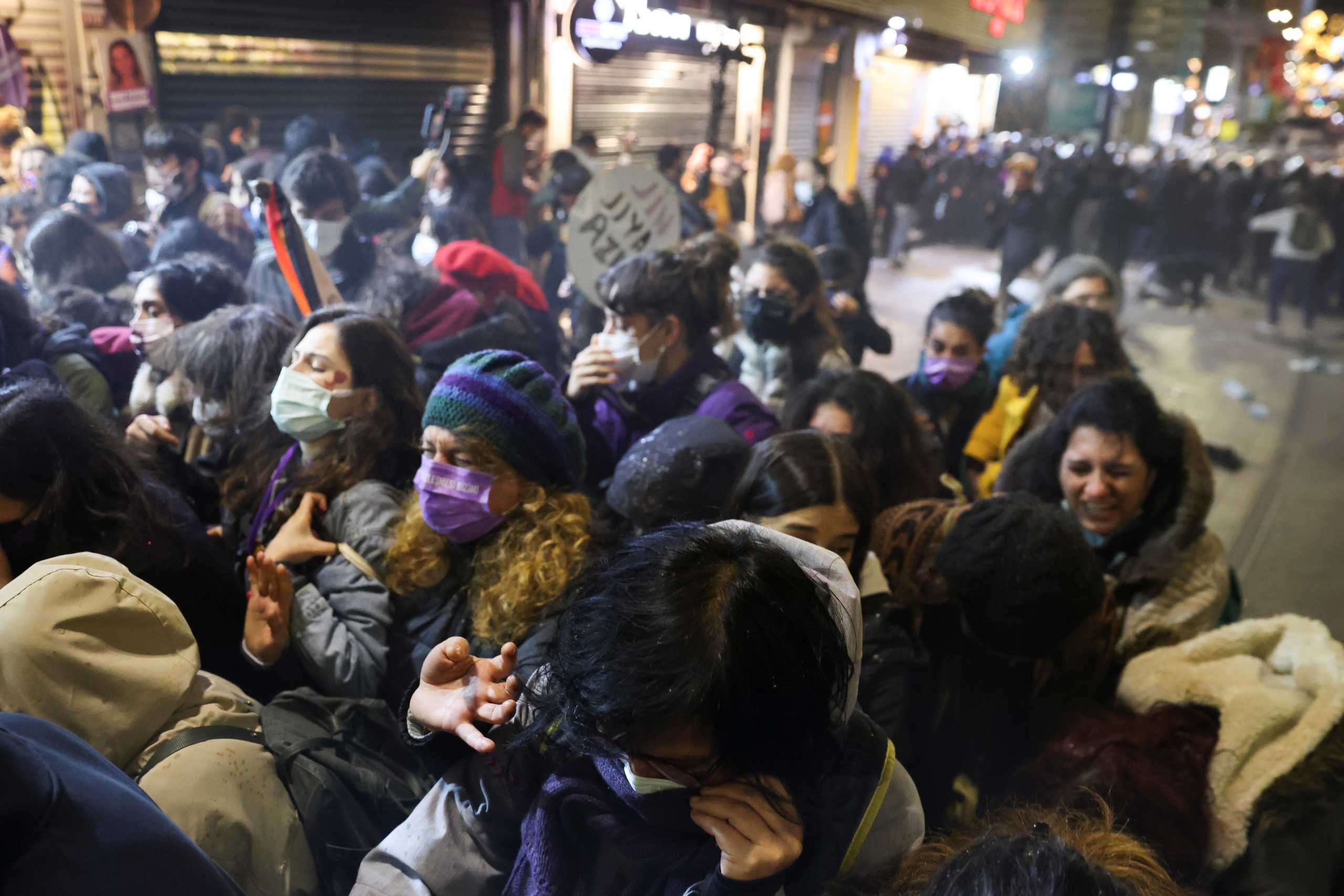 Demonstrators run away from a tear gas during a protest against gender-based violence on the International Day for the Elimination of Violence Against Women, in Istanbul, Turkey November 25, 2021. REUTERS