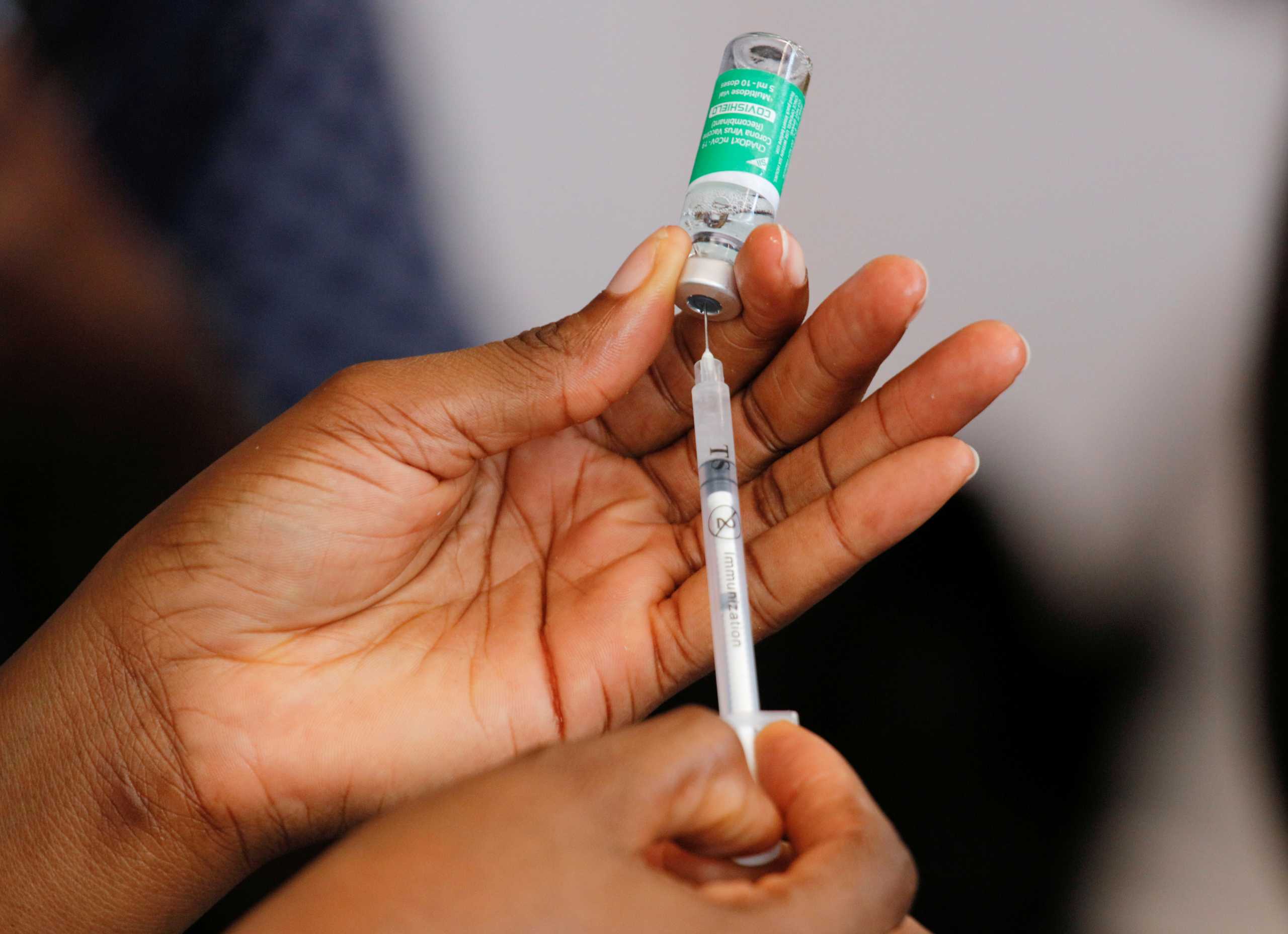 FILE PHOTO: A nurse prepares a dose of the of coronavirus disease (COVID-19) vaccine during the vaccination campaign at the Ridge Hospital in Accra, Ghana, March 2, 2021. REUTERS