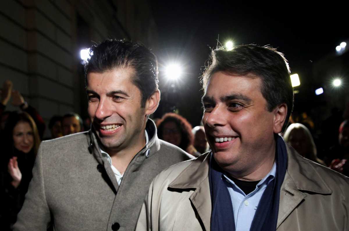 Kiril Petkov and Assen Vassilev, leaders of Bulgaria's new centrist party "We Continue the Change", react after the first exit polls during parliamentary and presidential elections, in Sofia, Bulgaria, November 14, 2021. REUTERS