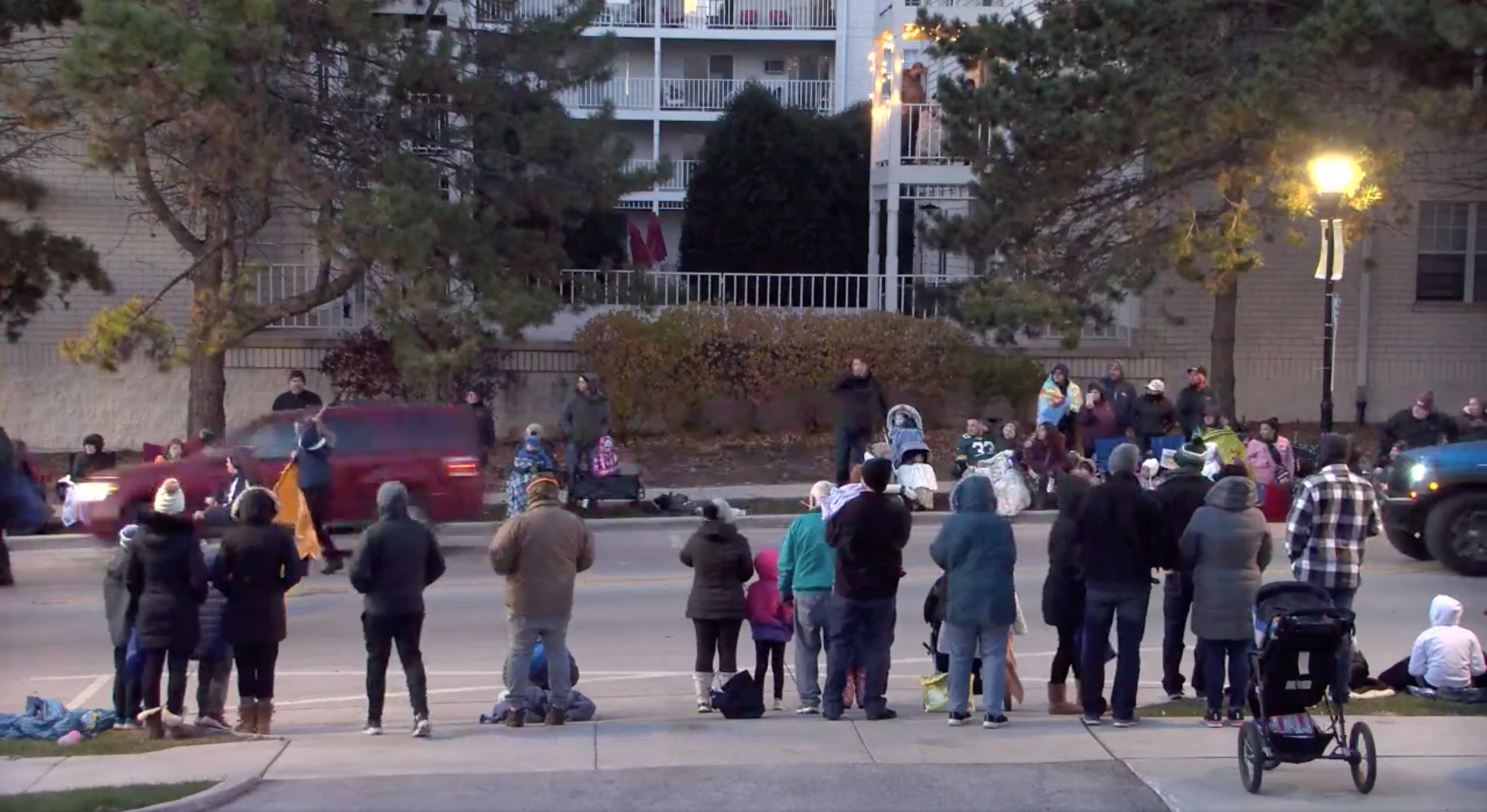 A red SUV speeds past attendees moments before plowing into a crowd at a Christmas parade in Waukesha, Wisconsin, U.S., in this still image taken from a November 21, 2021 social media video. CITY OF WAUKESHA