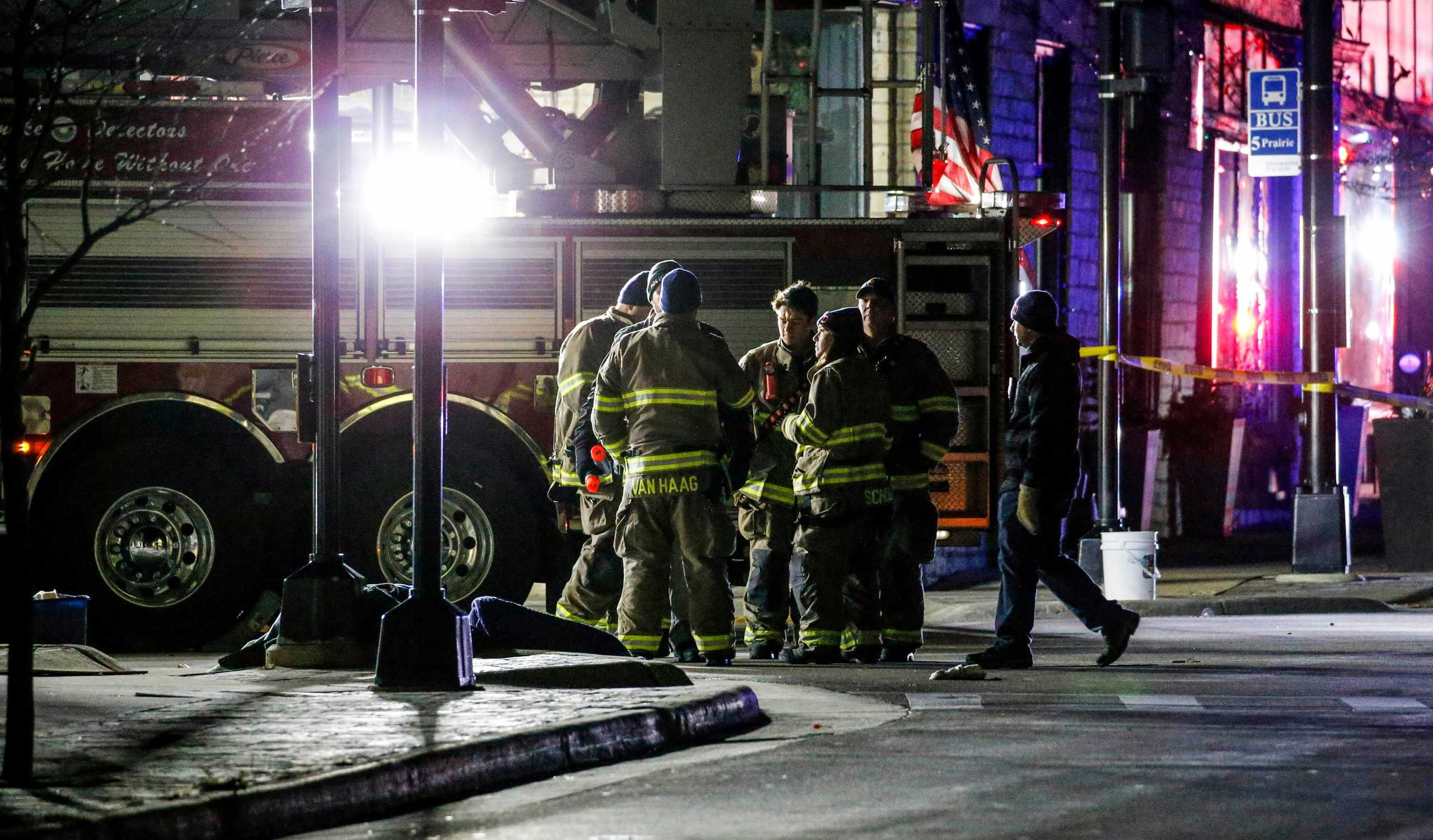 Emergency responders gather after a vehicle plowed through the Christmas Parade, leaving multiple people injured in Waukesha, Wisconsin, U.S. November 21, 2021. Scott Ash-USA TODAY NETWORK via REUTERS        NO RESALES. NO ARCHIVES. MANDATORY CREDIT