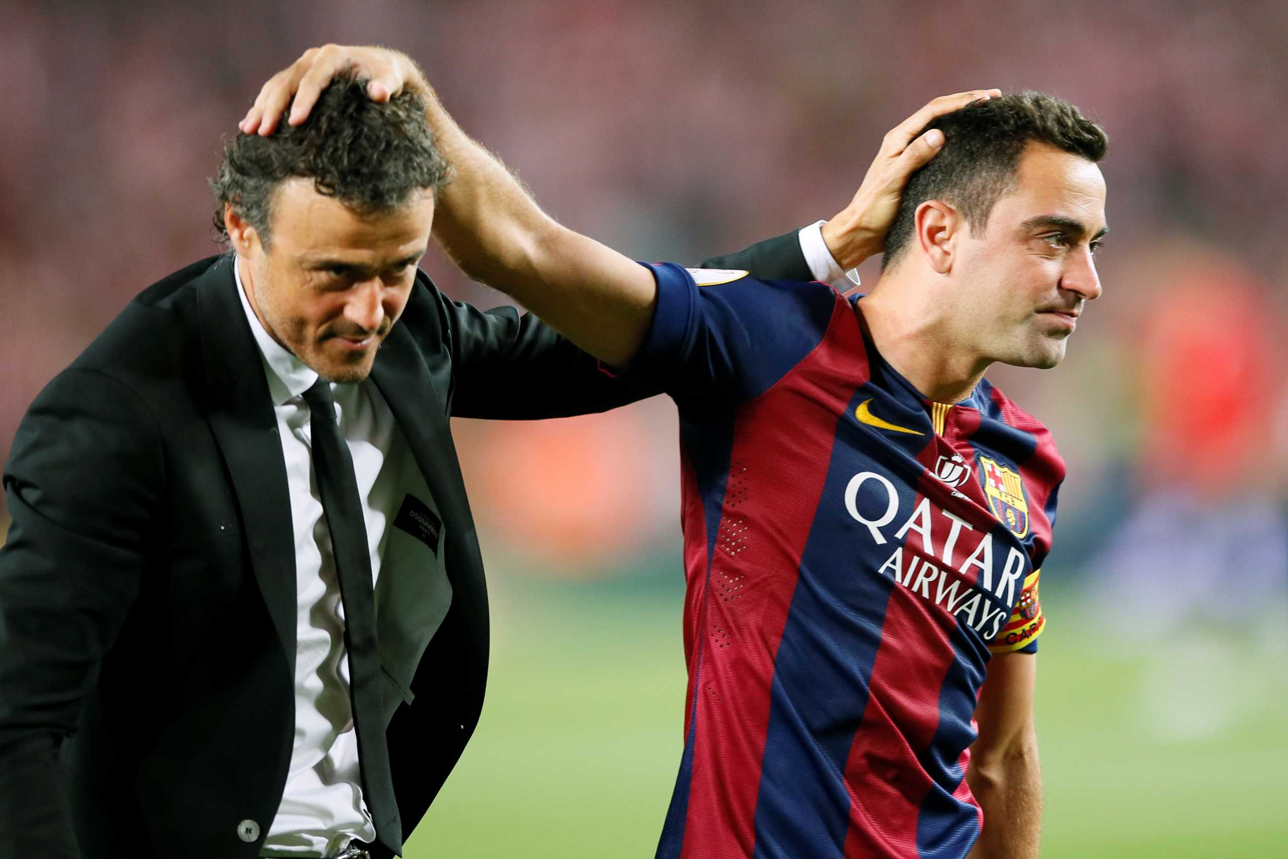 FILE PHOTO: Football - Athletic Bilbao v FC Barcelona - Spanish King's Cup Final - Nou Camp - Barcelona, Spain - May 30, 2015 Barcelona's Xavi and coach Luis Enrique celebrate winning the Spanish King's Cup Final  Reuters