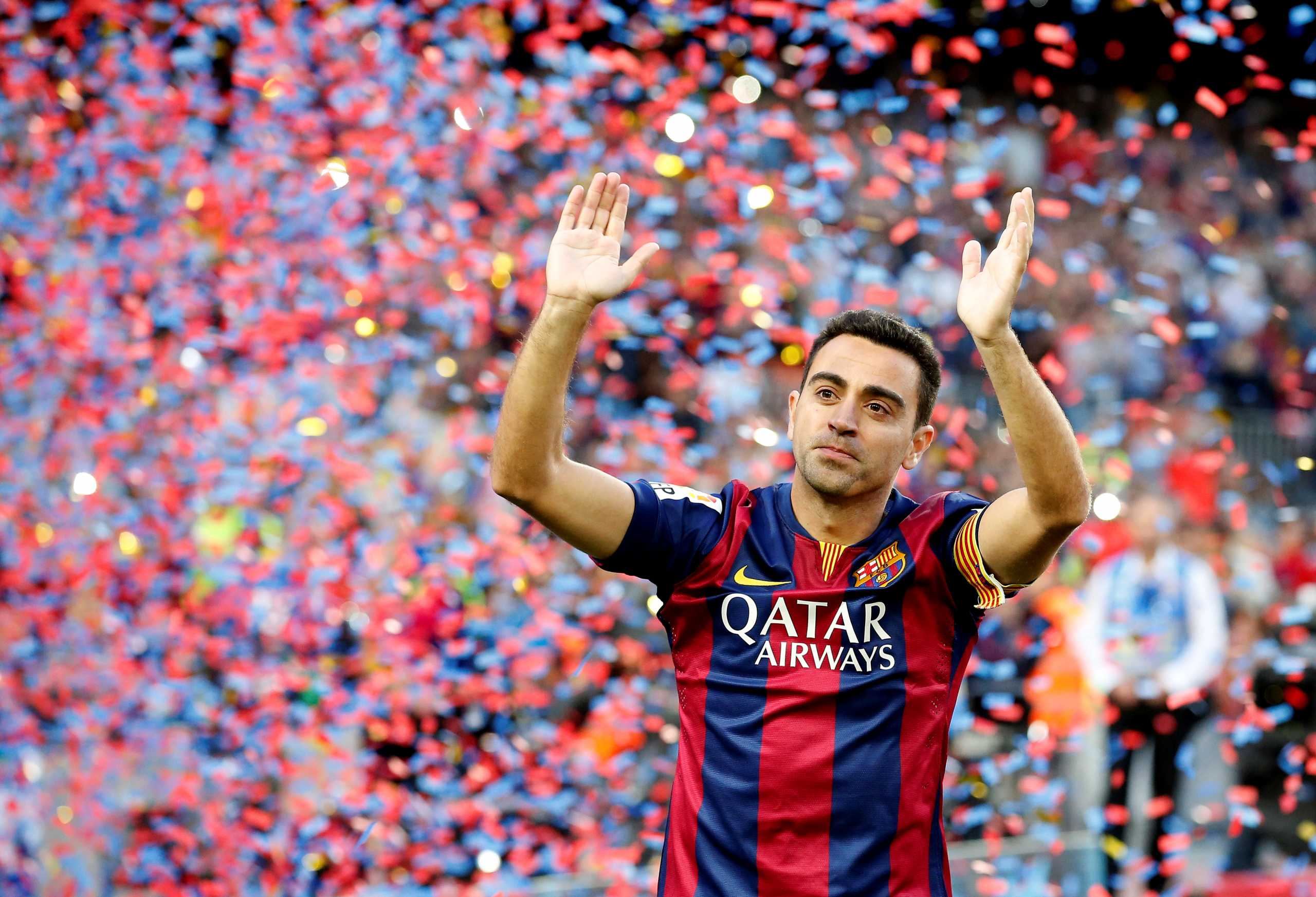 FILE PHOTO: Barcelona's Xavi Hernandez waves to supporters after their Spanish first division soccer match against Deportivo de la Coruna at Camp Nou stadium in Barcelona, Spain, May 23, 2015. REUTERS