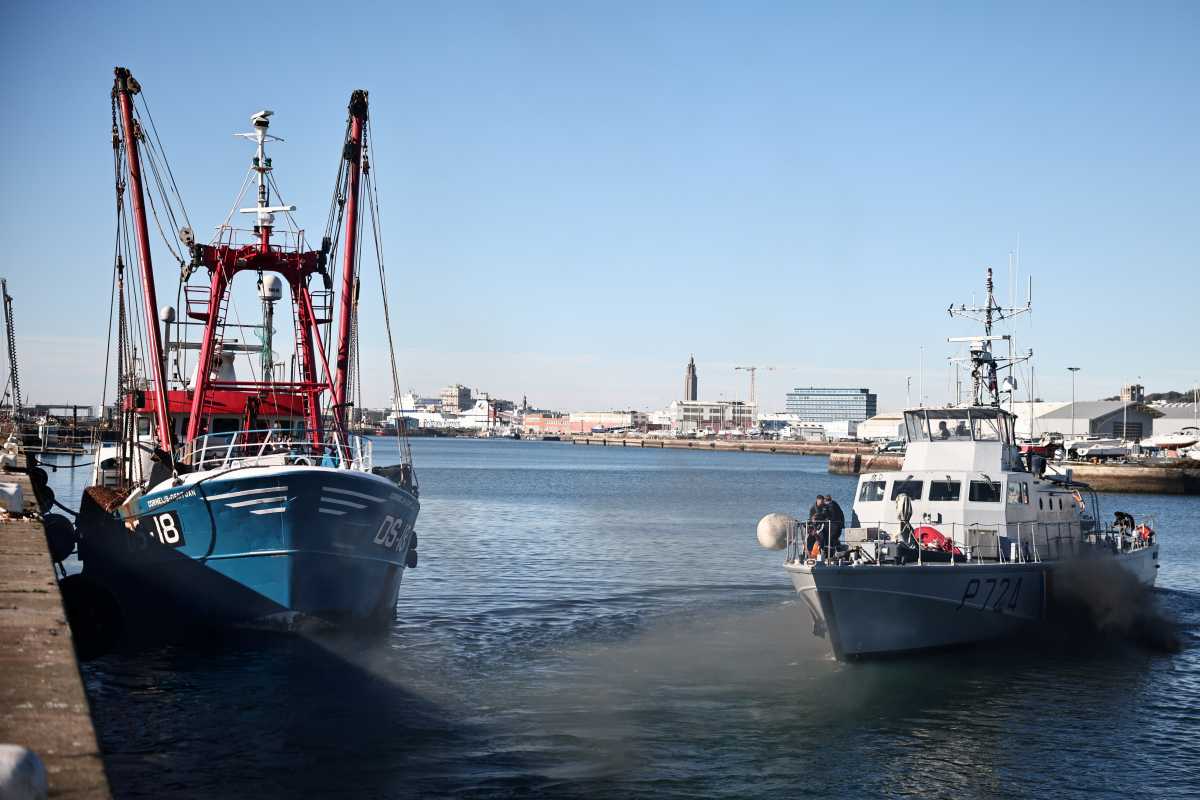 The French Gendarmerie patrol boat Athos leaves as a British trawler Cornelis Gert Jan is seen moored in the port of Le Havre after France seized on Thursday a British trawler fishing in its territorial waters without a licence, in Le Havre, France, October 28, 2021. REUTERS