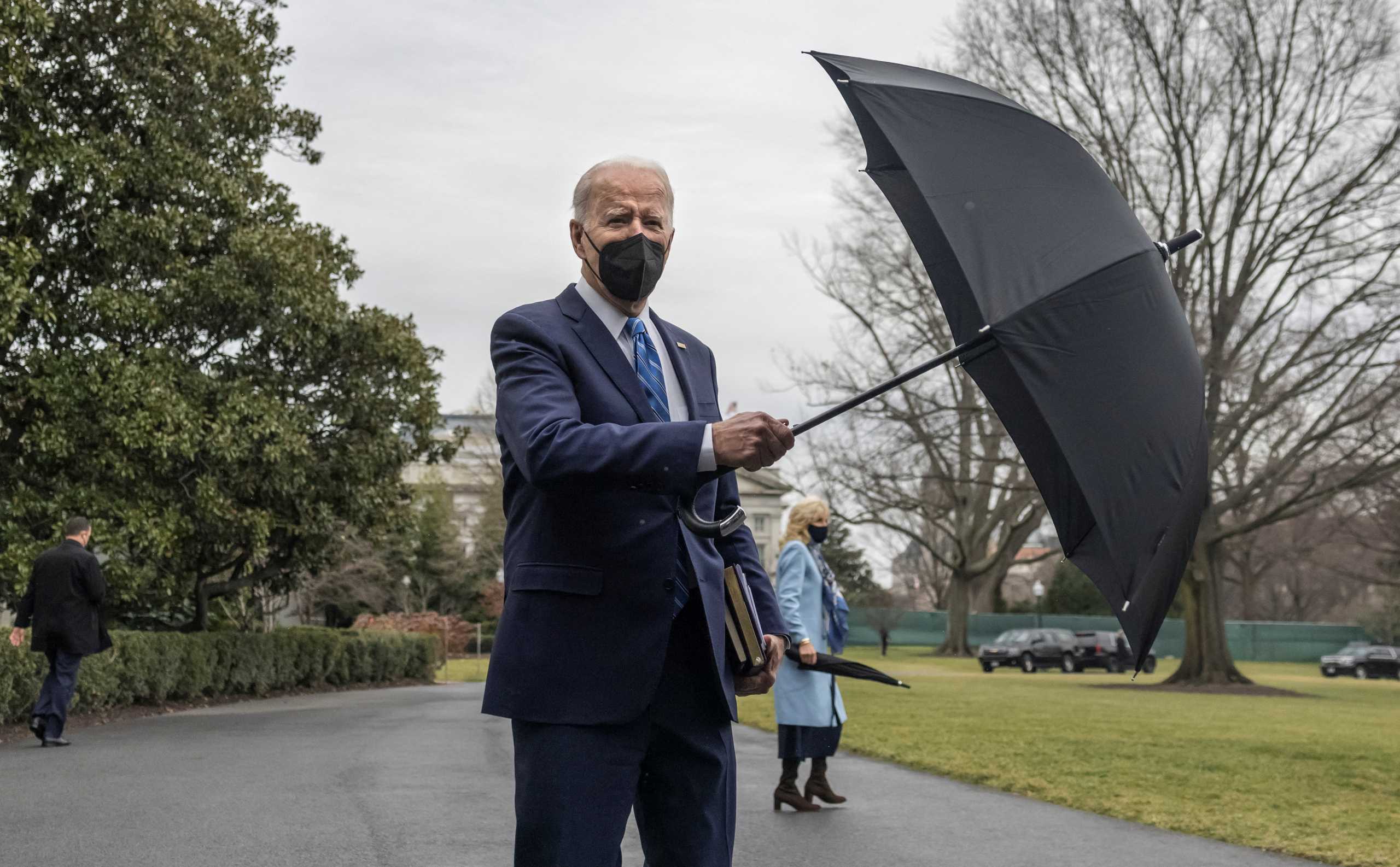 U.S. President Joe Biden and First Lady Jill Biden walk towards Marine One en route to Rehoboth Beach, Delaware, from the White House in Washington, U.S., December 27, 2021. REUTERS