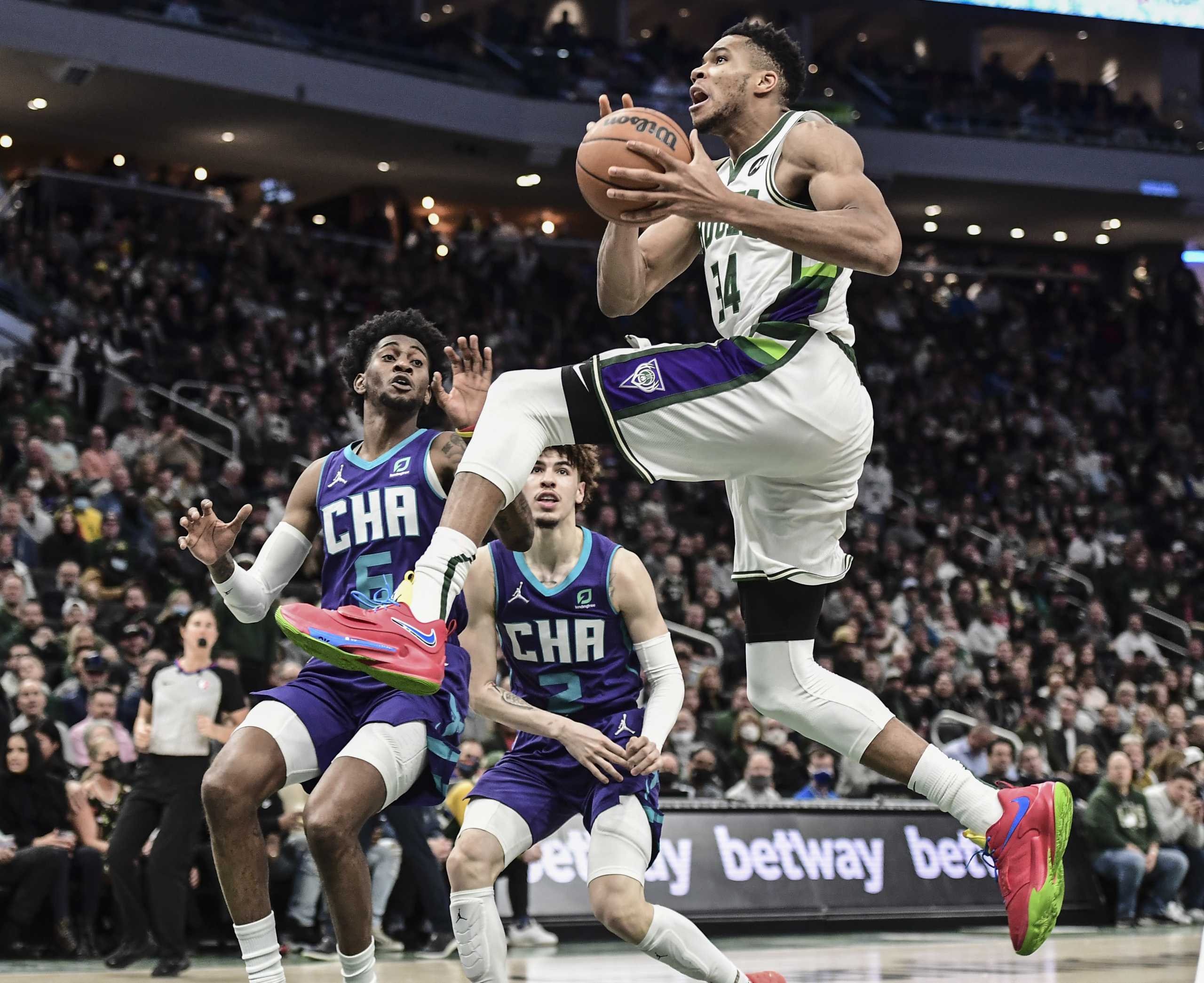 Dec 1, 2021; Milwaukee, Wisconsin, USA; Milwaukee Bucks forward Giannis Antetokounmpo (34) drives for the basket against Charlotte Hornets forward Jalen McDaniels (6) in the fourth quarter at Fiserv Forum. Mandatory Credit: Benny Sieu-USA TODAY Sports