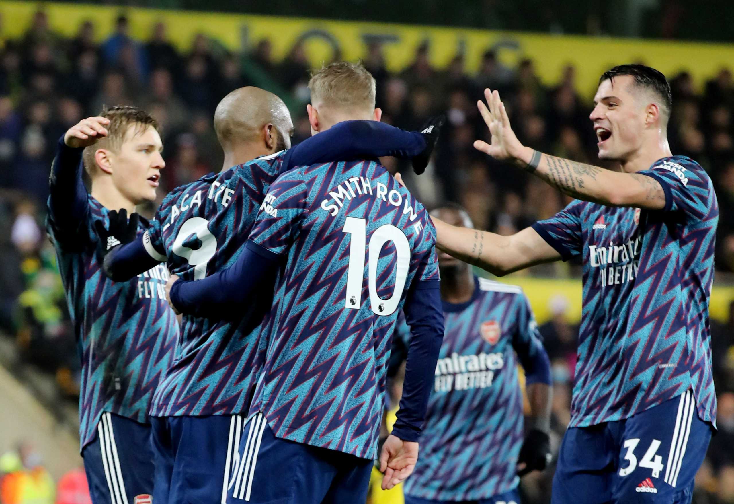 Soccer Football - Premier League - Norwich City v Arsenal - Carrow Road, Norwich, Britain - December 26, 2021 Arsenal's Alexandre Lacazette celebrates scoring their fourth goal with Martin Odegaard, Emile Smith Rowe and Granit Xhaka REUTERS