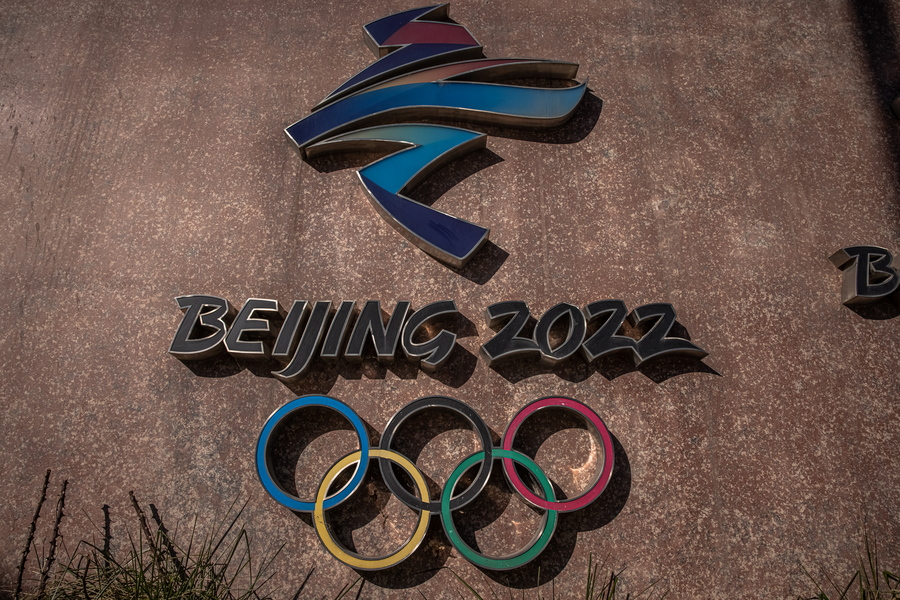 epa09614042 The 2022 Beijing Winter Olympic emblem is seen next to the headquarters of the 2022 Beijing Winter Olympics organising committee, at the Shougang Industrial Park, which will be used as a venue for hosting sport and other events during Beijing 2022 Winter Olympics, in Beijing, China, 01 December 2021. According to China's epidemiologist experts, the new Omicron COVID-19 variant, which poses a high risk globally, at this moment wouldn't have a strong impact on China, which is scheduled in two months to host The 2022 Beijing Winter Olympics followed by the Paralympics.  EPA