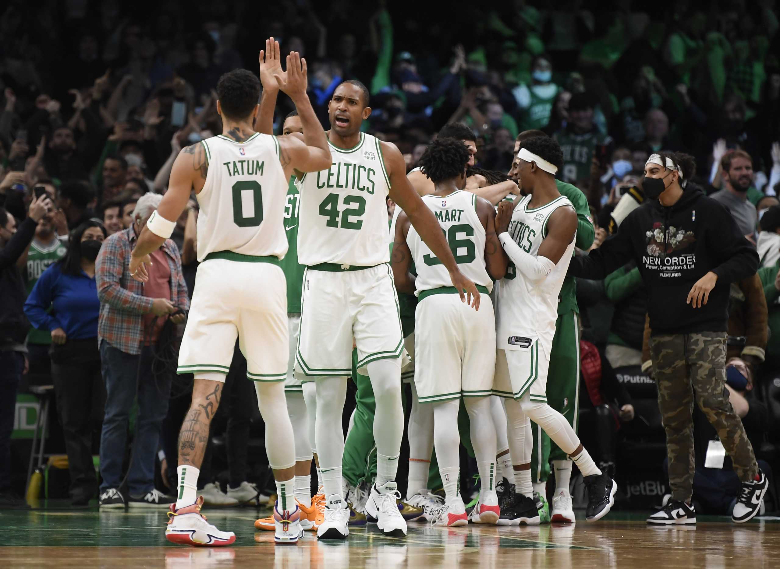 Dec 1, 2021; Boston, Massachusetts, USA; Boston Celtics forward Jayson Tatum (0) high fives center Al Horford (42) after defeating the Philadelphia 76ers at TD Garden. Mandatory Credit: Bob DeChiara-USA TODAY Sports