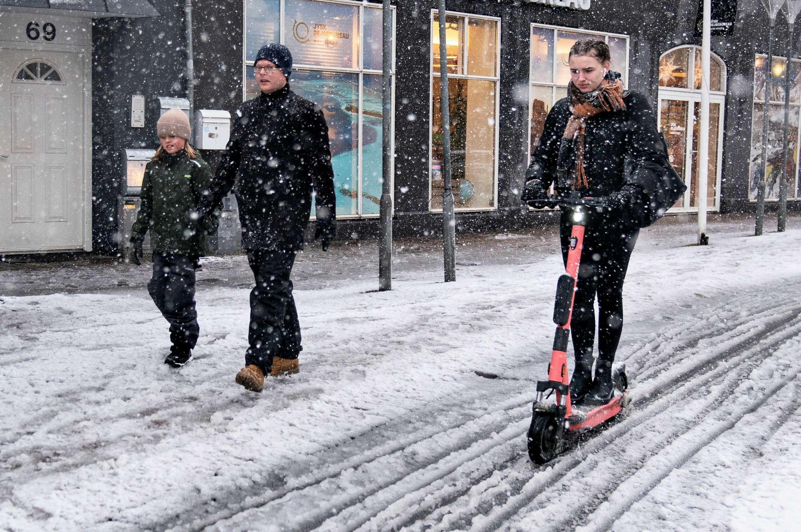 People brave the snow in Aalborg, Denmark December 1, 2021. Ritzau Scanpix
