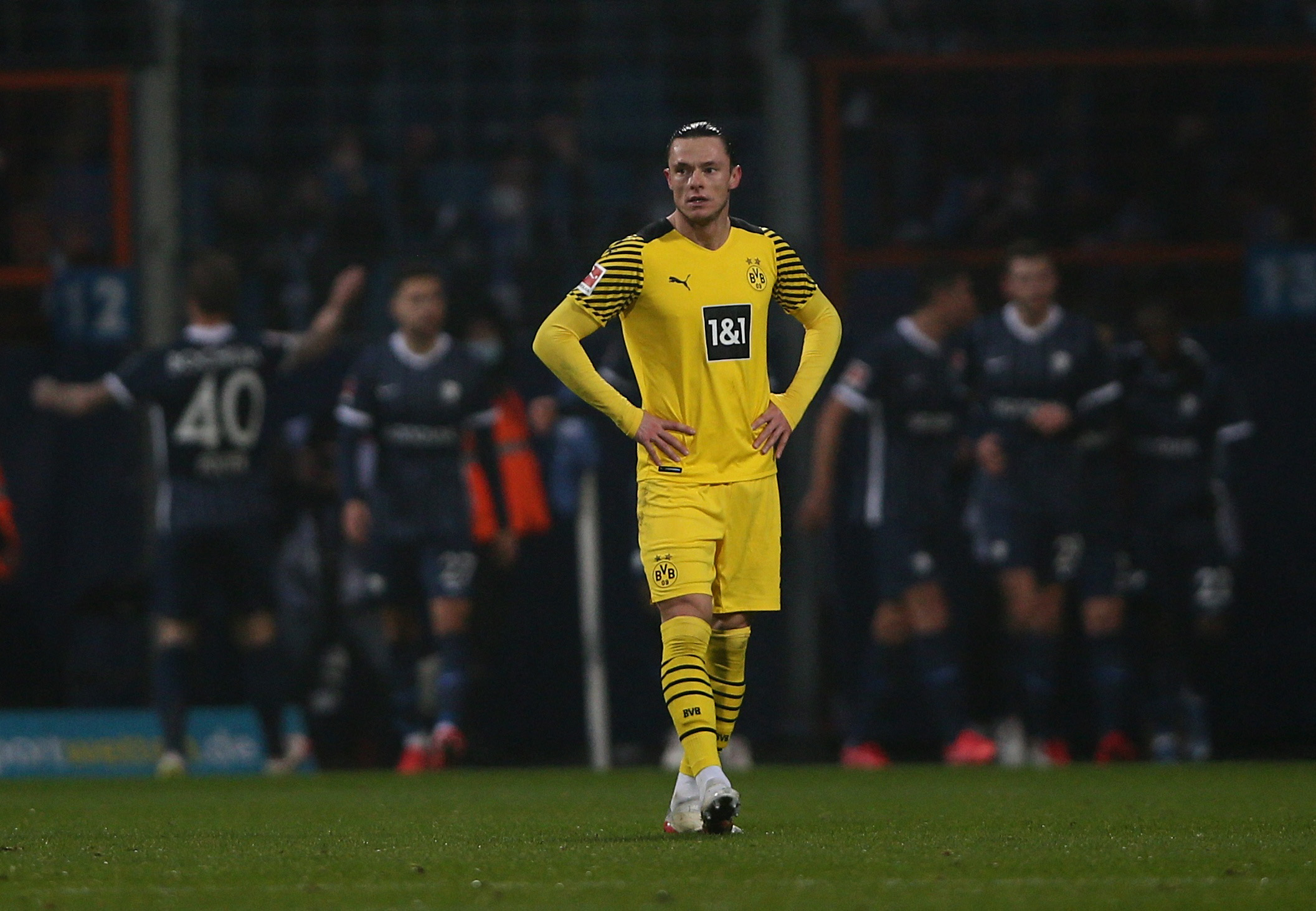 Soccer Football - Bundesliga - VfL Bochum v Borussia Dortmund - Ruhrstadion, Bochum, Germany - December 11, 2021 Borussia Dortmund's Nico Schulz looks dejected after VfL Bochum's Sebastian Polter scores their first goal REUTERS