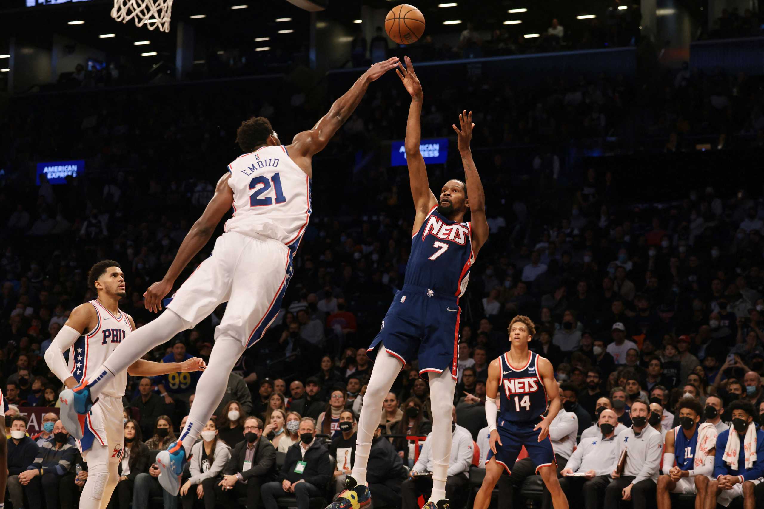 Dec 16, 2021; Brooklyn, New York, USA; Brooklyn Nets forward Kevin Durant (7) shoots the ball as Philadelphia 76ers center Joel Embiid (21) defends during the second half at Barclays Center. Mandatory Credit: Vincent Carchietta-USA TODAY Sports