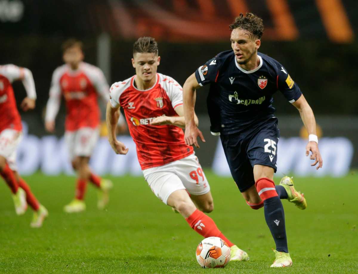 Soccer Football - Europa League - Group F - S.C. Braga v Crvena Zvezda - Estadio Municipal de Braga, Braga, Portugal - December 9, 2021 S.C. Braga's Vitor Oliveira in action with Crvena Zvezda's Strahinja Erakovic REUTERS