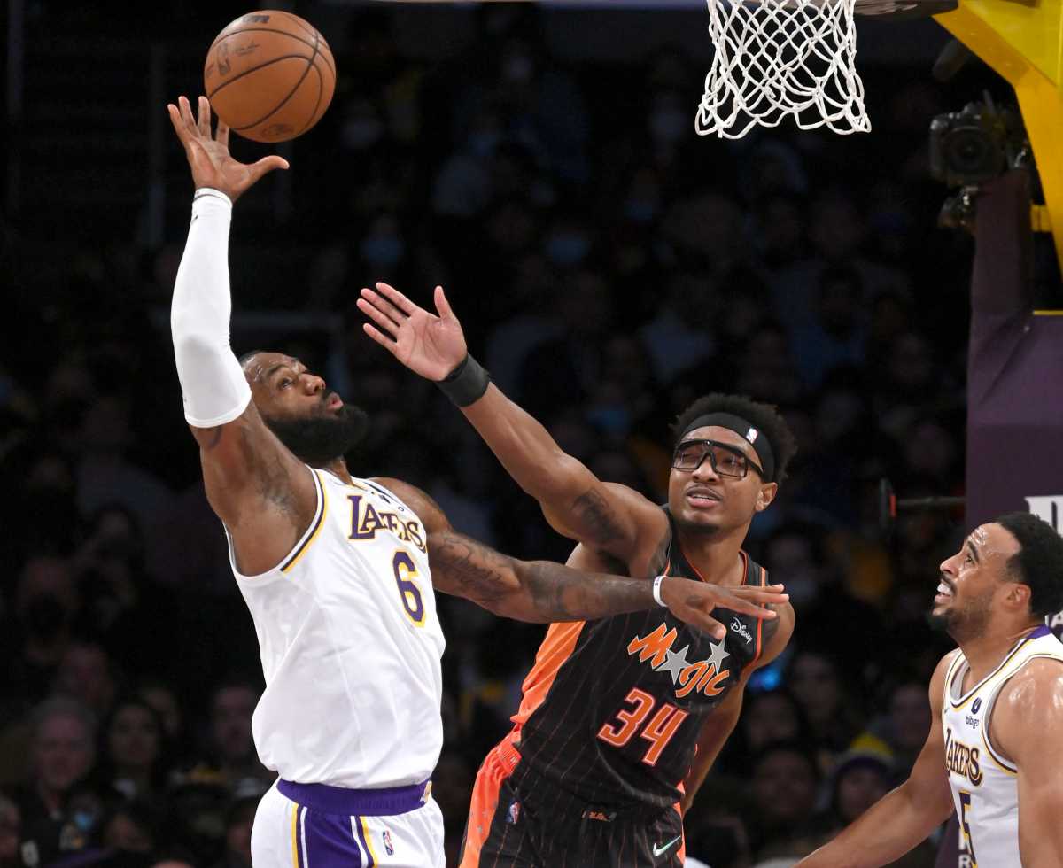 Dec 12, 2021; Los Angeles, California, USA;  Los Angeles Lakers forward LeBron James (6) beats Orlando Magic center Wendell Carter Jr. (34) to a rebound in the first half at Staples Center. Mandatory Credit: Jayne Kamin-Oncea-USA TODAY Sports
